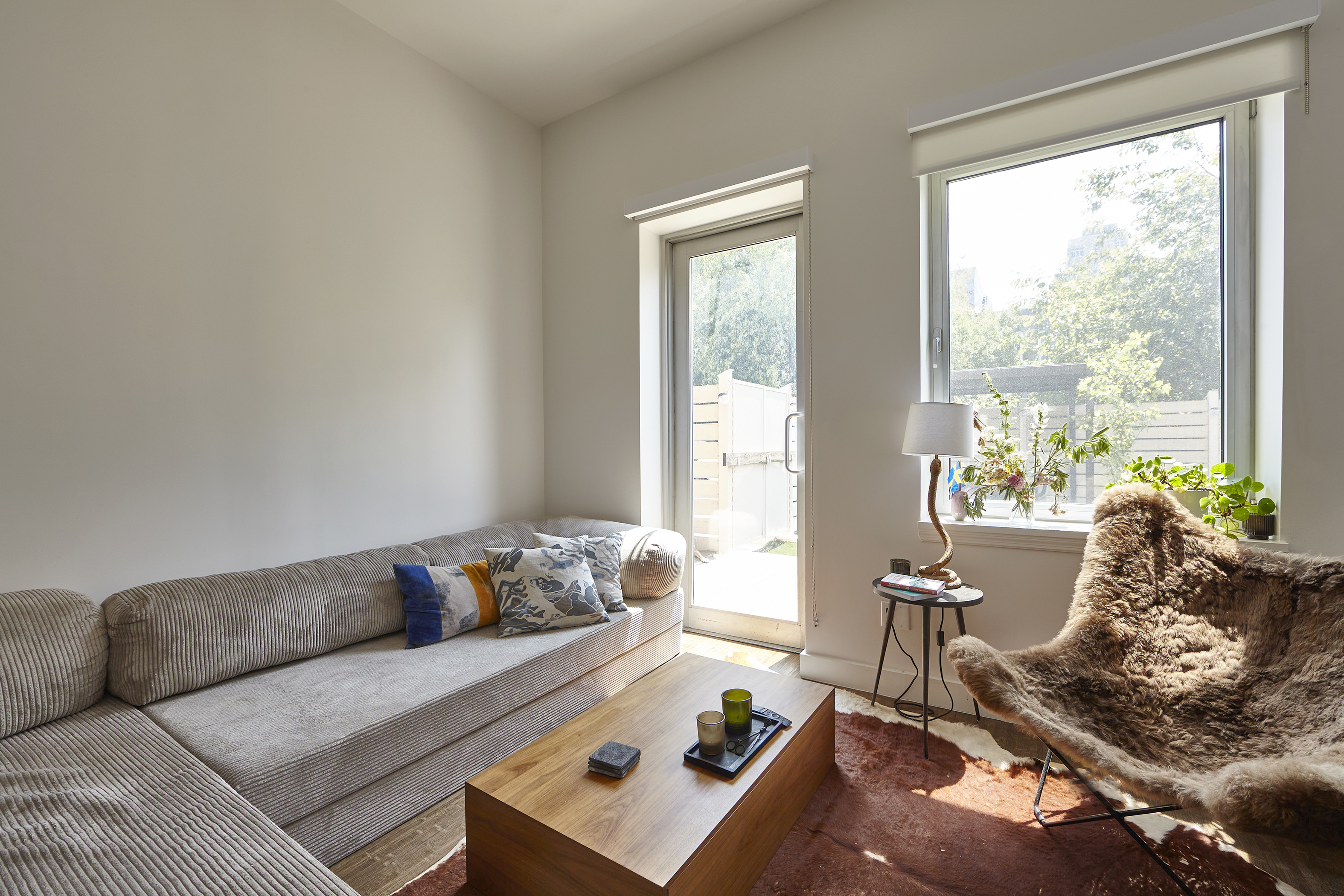144 North 10th Street, Unit 2D Brooklyn, NY 11249 - Photo 4 of 12 a living room with furniture and a window
