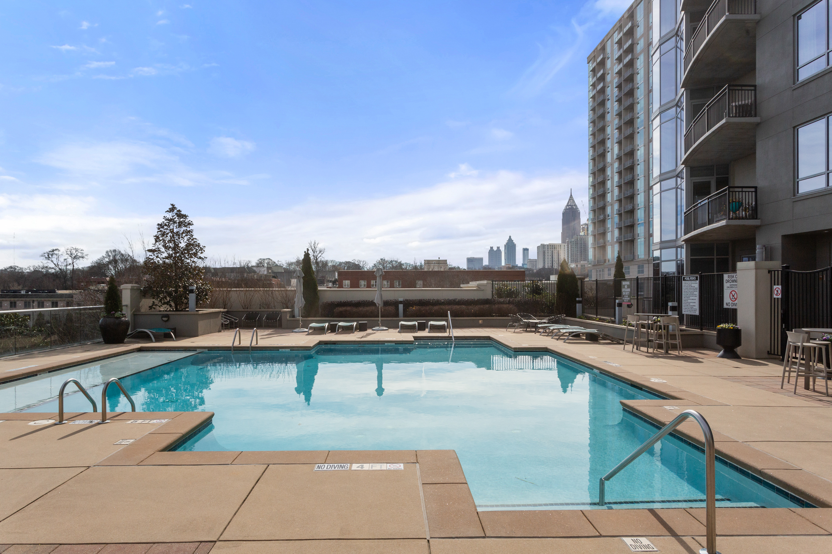 222 12th Street Northeast Atlanta, GA 30309 - Photo 41 of 56 a view of a swimming pool with a lounge chair