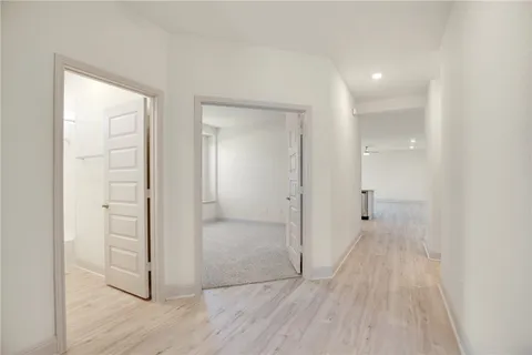 wooden floor with white walls