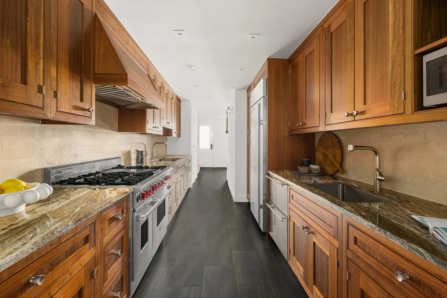 a kitchen with stainless steel appliances granite countertop a stove and a sink