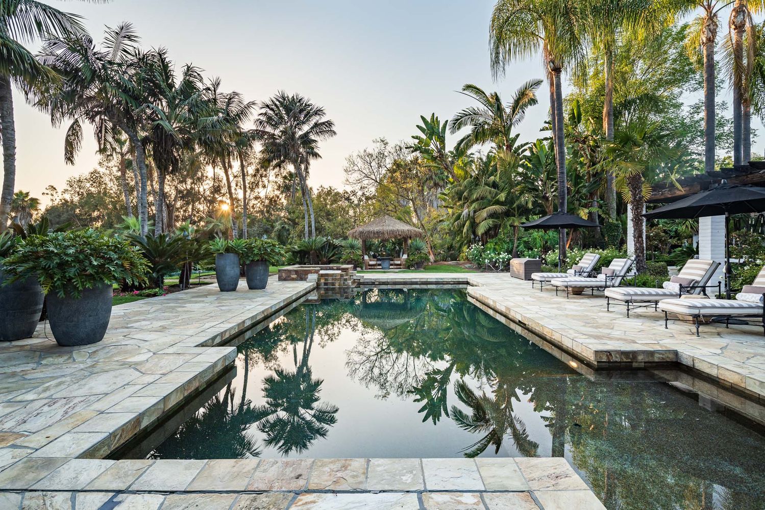 a view of swimming pool with chairs