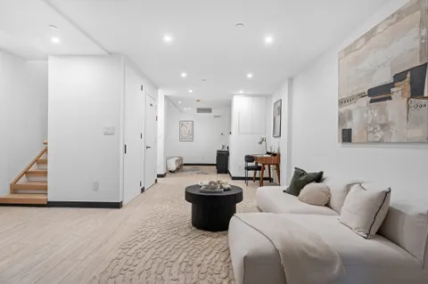 a large room with bed and a view of bathroom