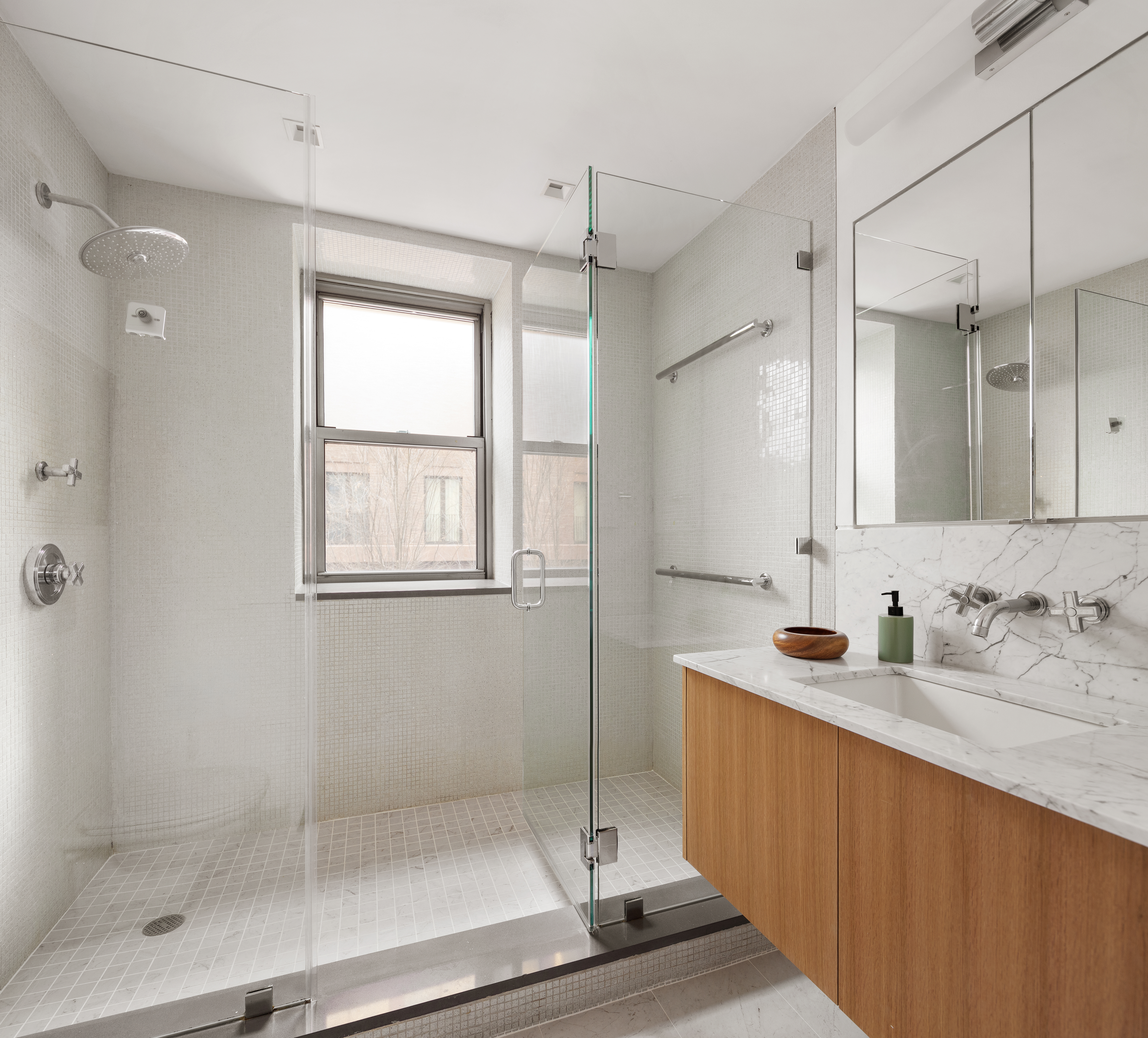 2 Horatio Street, Unit 2PR Manhattan, NY 10014 - Photo 10 of 14 a bathroom with a shower sink and mirror