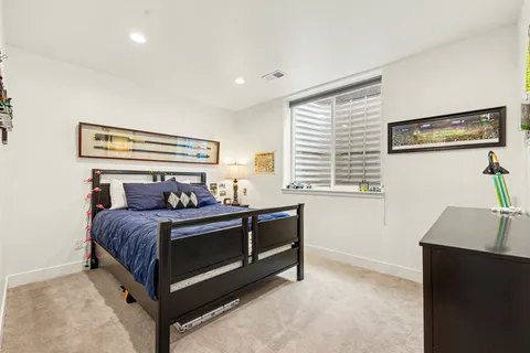 a bed room with a bed and a window