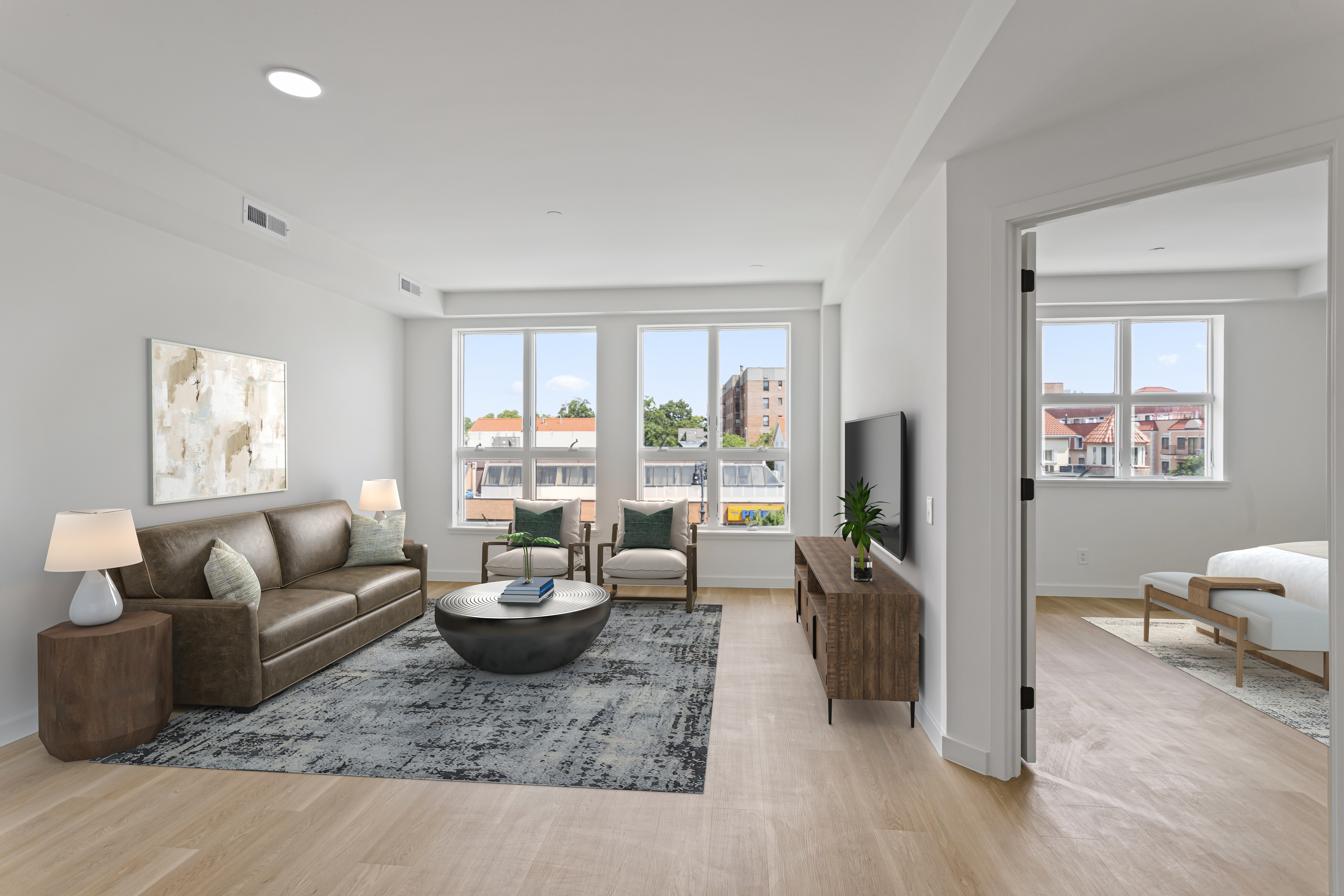 a living room with furniture and a large window
