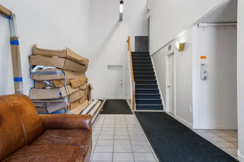 a room with lots of furniture and a large window