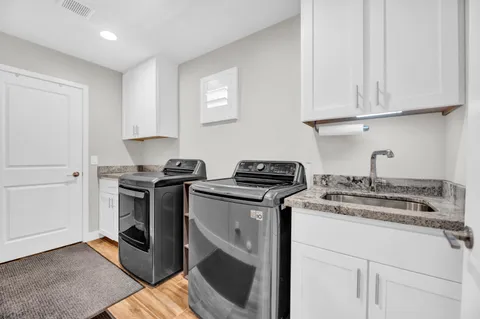 a kitchen with a stove and a sink
