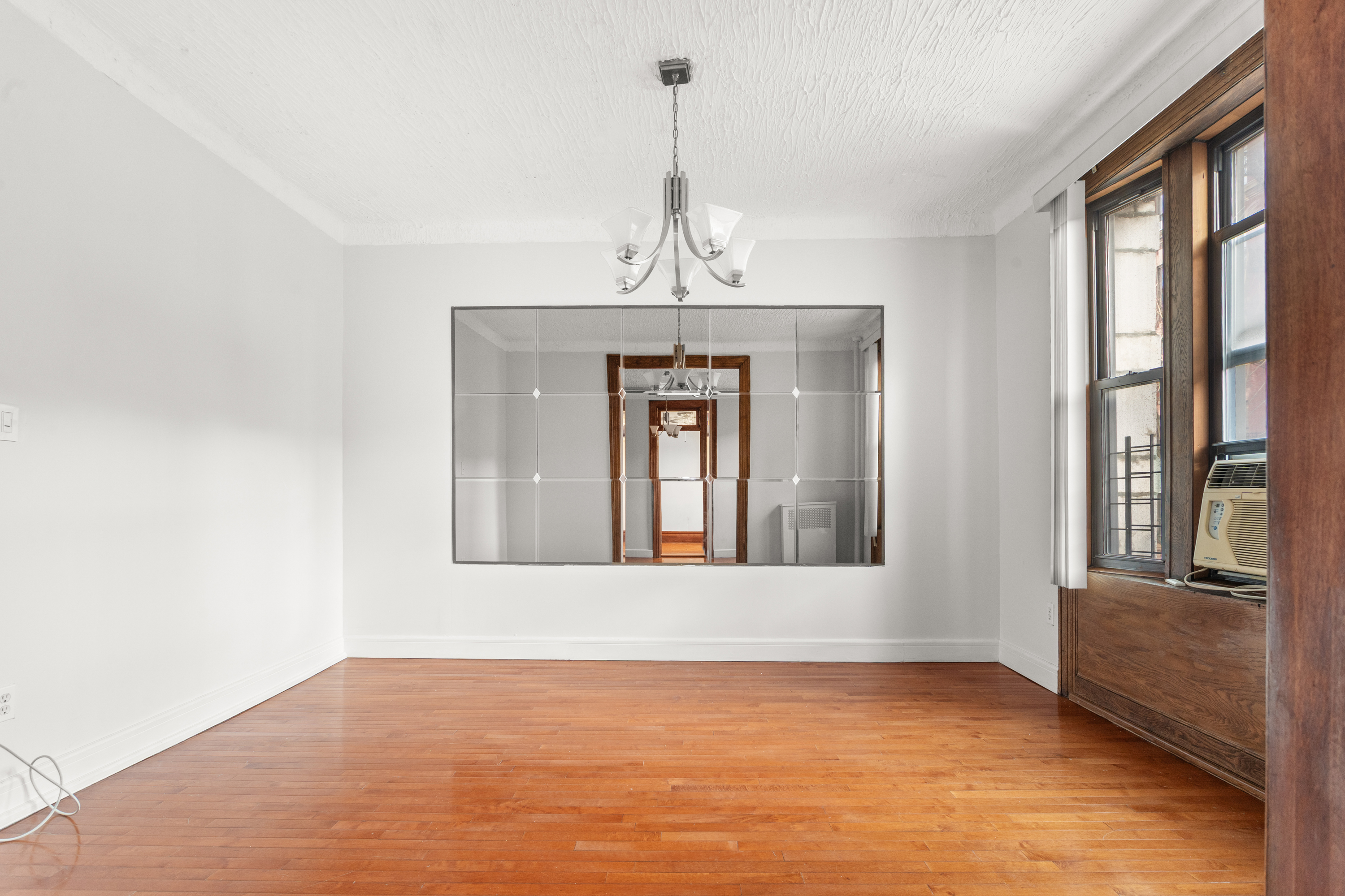 527 West 143rd Street, Unit 31 Manhattan, NY 10031 - Photo 2 of 29 a view of an empty room with a window