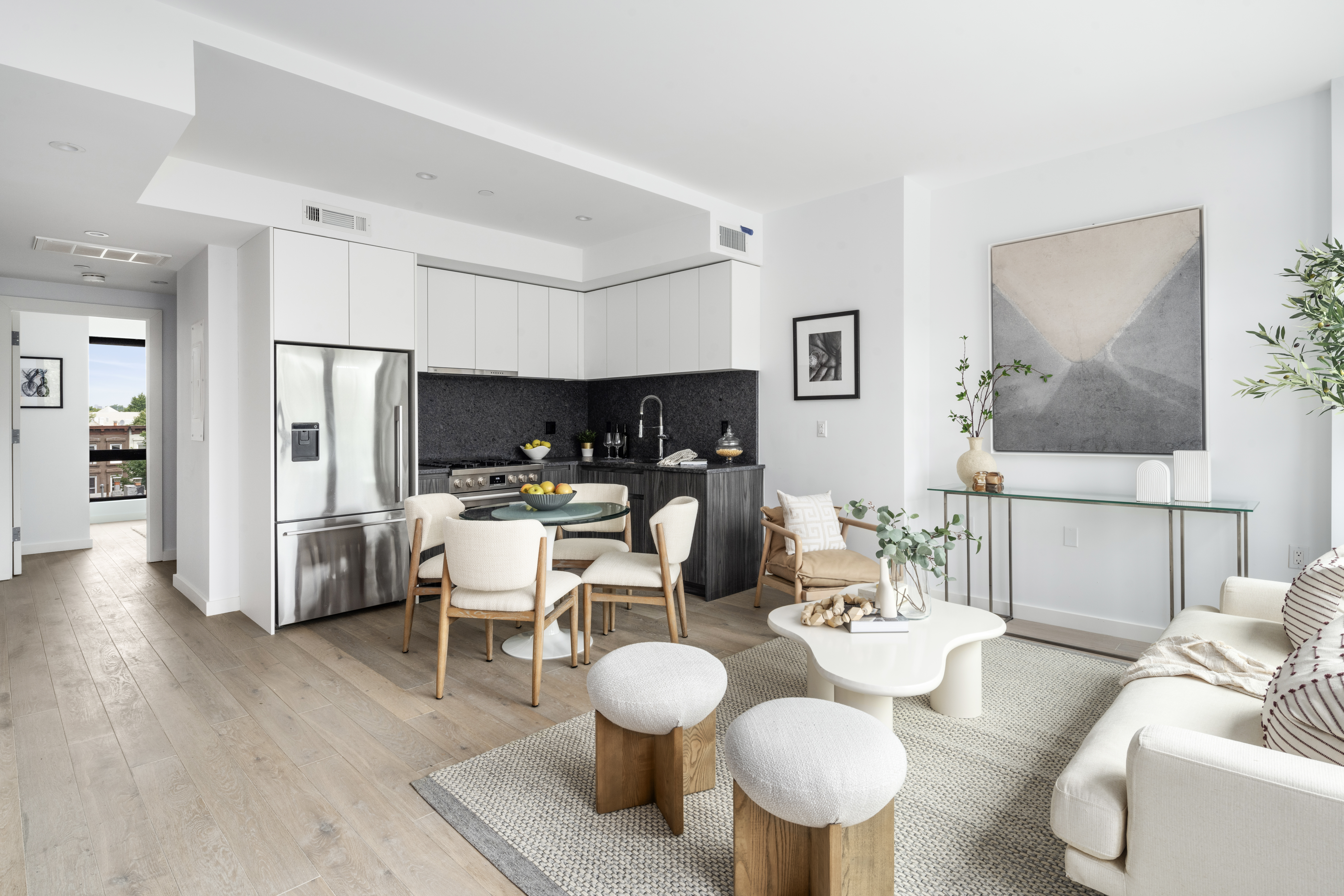 435 Tompkins Avenue, Unit PH505 Brooklyn, NY 11216 - Photo 4 of 14 a dining room with furniture and wooden floor