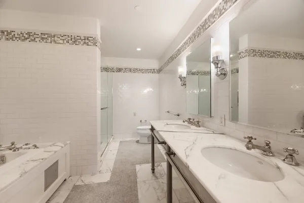a bathroom with a sink double vanity and a mirror