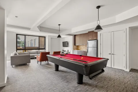 a spacious bedroom with a bed and a table