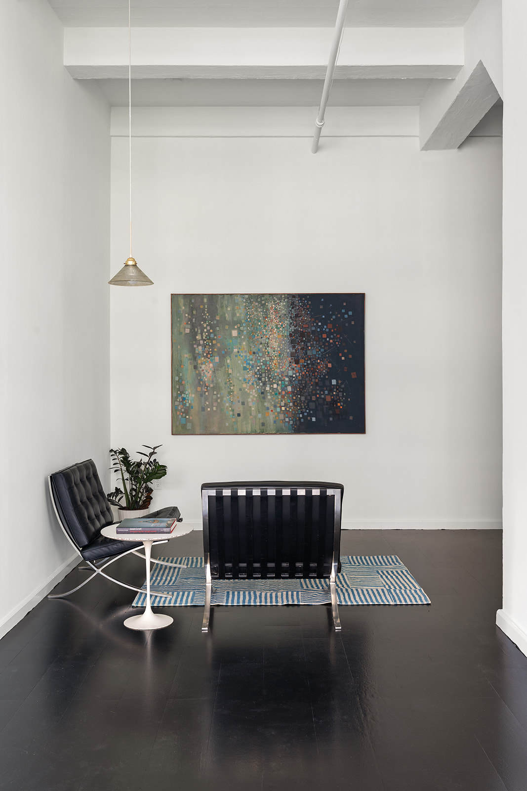 348 West 38th Street, Unit 9E Manhattan, NY 10018 - Photo 7 of 10 a living room with furniture and a rug