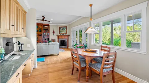 a dining room with furniture and window