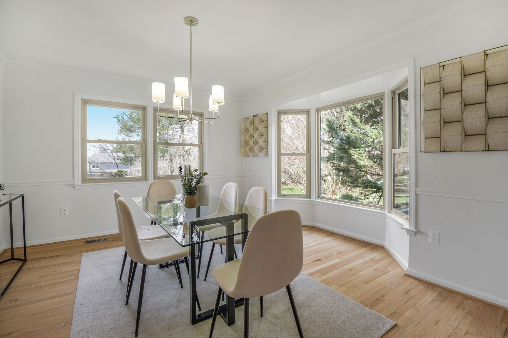 4008 Evangeline Terrace Olney, MD 20832 - Photo 13 of 54 a dining room with furniture a chandelier and wooden floor