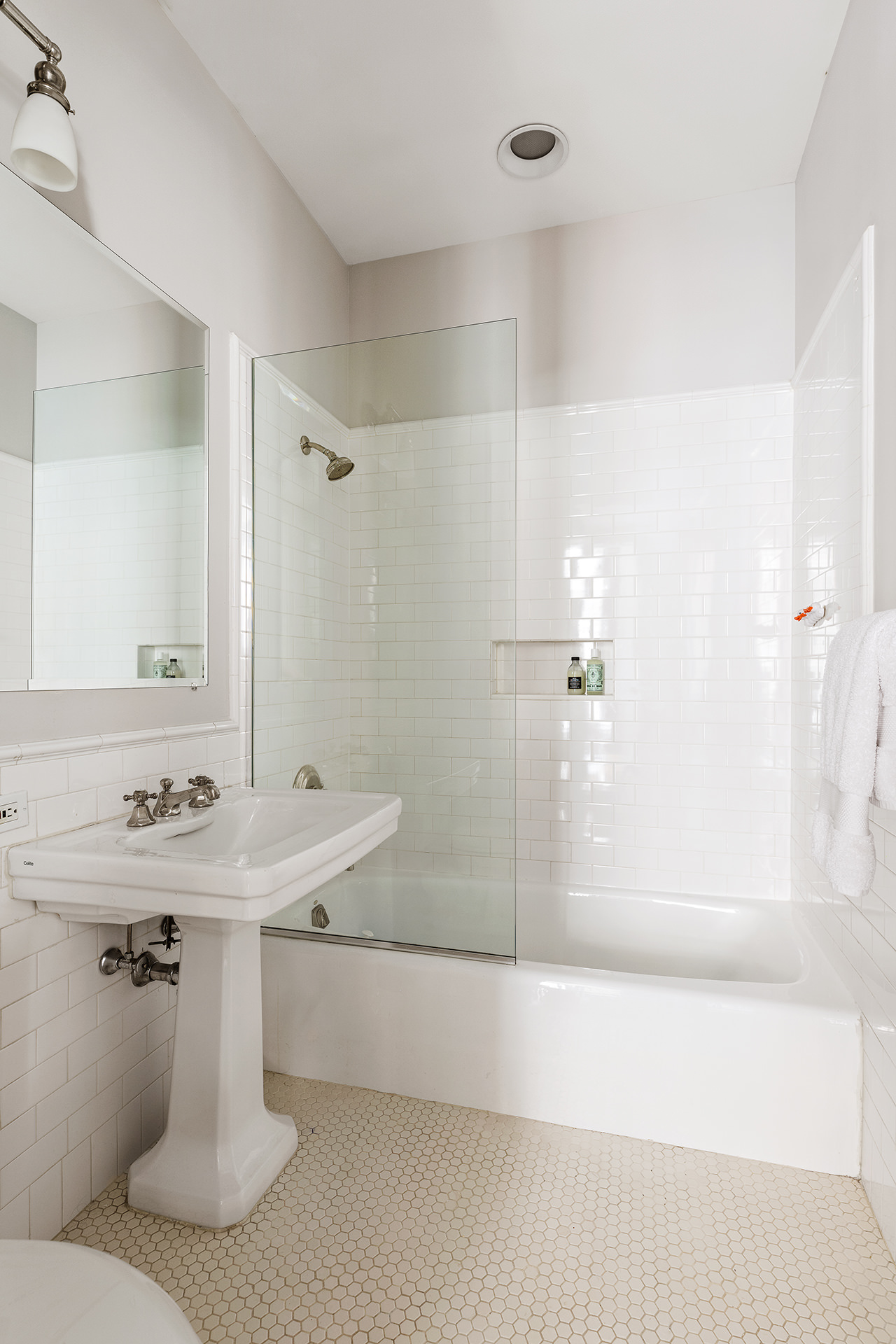 285 Lafayette Street, Unit 2B Manhattan, NY 10012 - Photo 11 of 19 a bathroom with a sink a toilet and shower