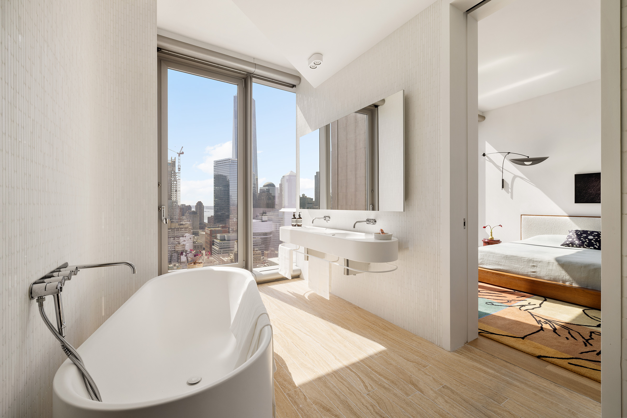 56 Leonard Street, Unit 33AWEST Manhattan, NY 10013 - Photo 7 of 12 a living room with furniture and a large window