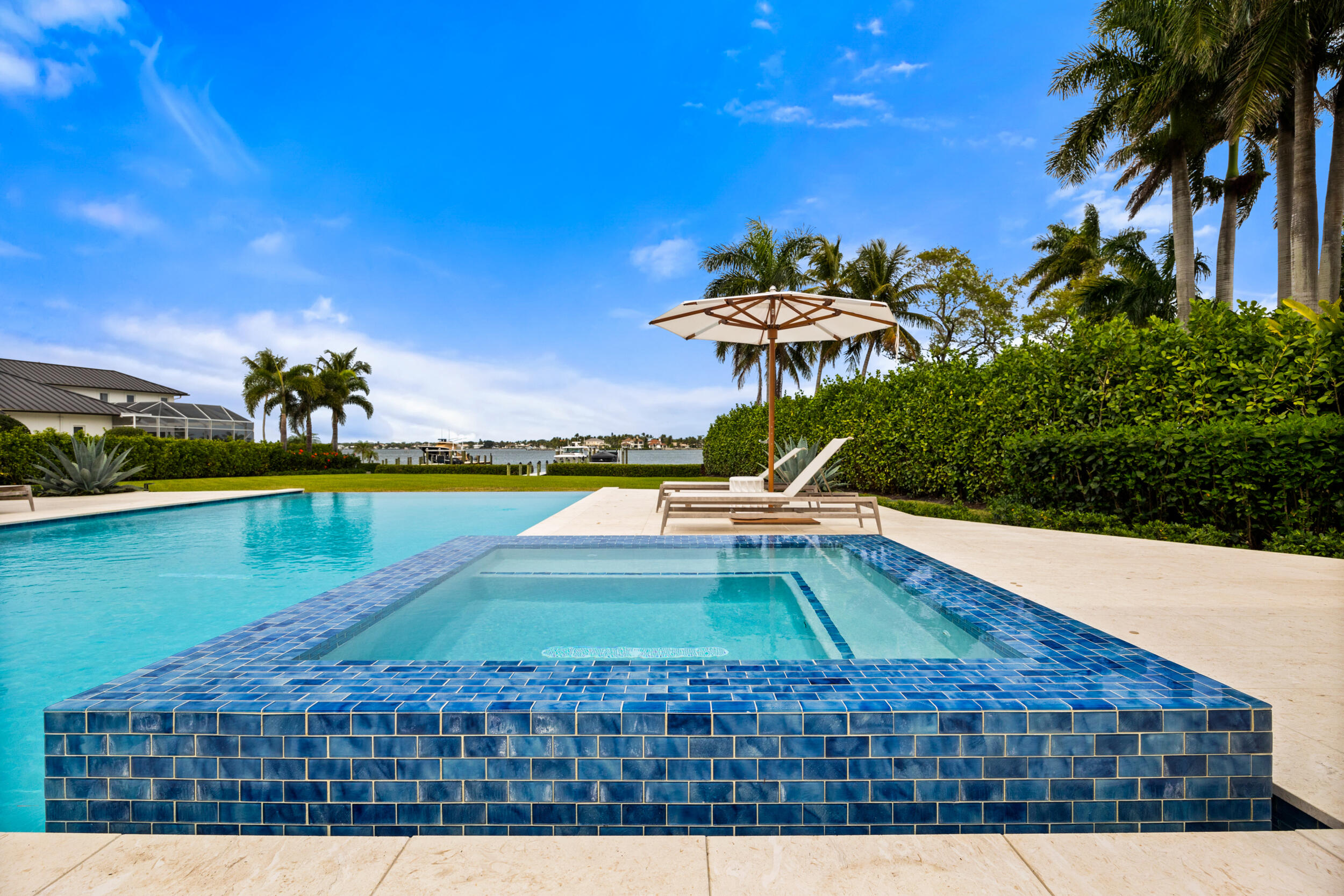 5695 Pennock Point Road Jupiter, FL 33458 - Photo 15 of 77 a view of a swimming pool with an outdoor space and seating area