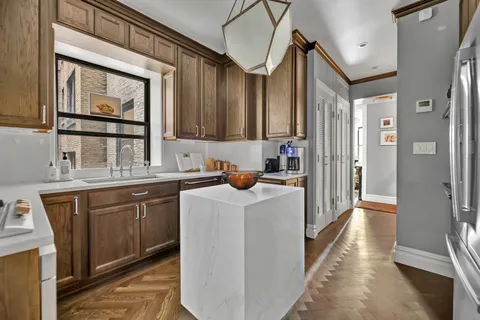 a kitchen that has a cabinets and a sink