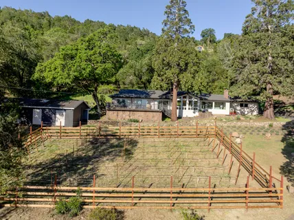 a view of a yard with an outdoor space