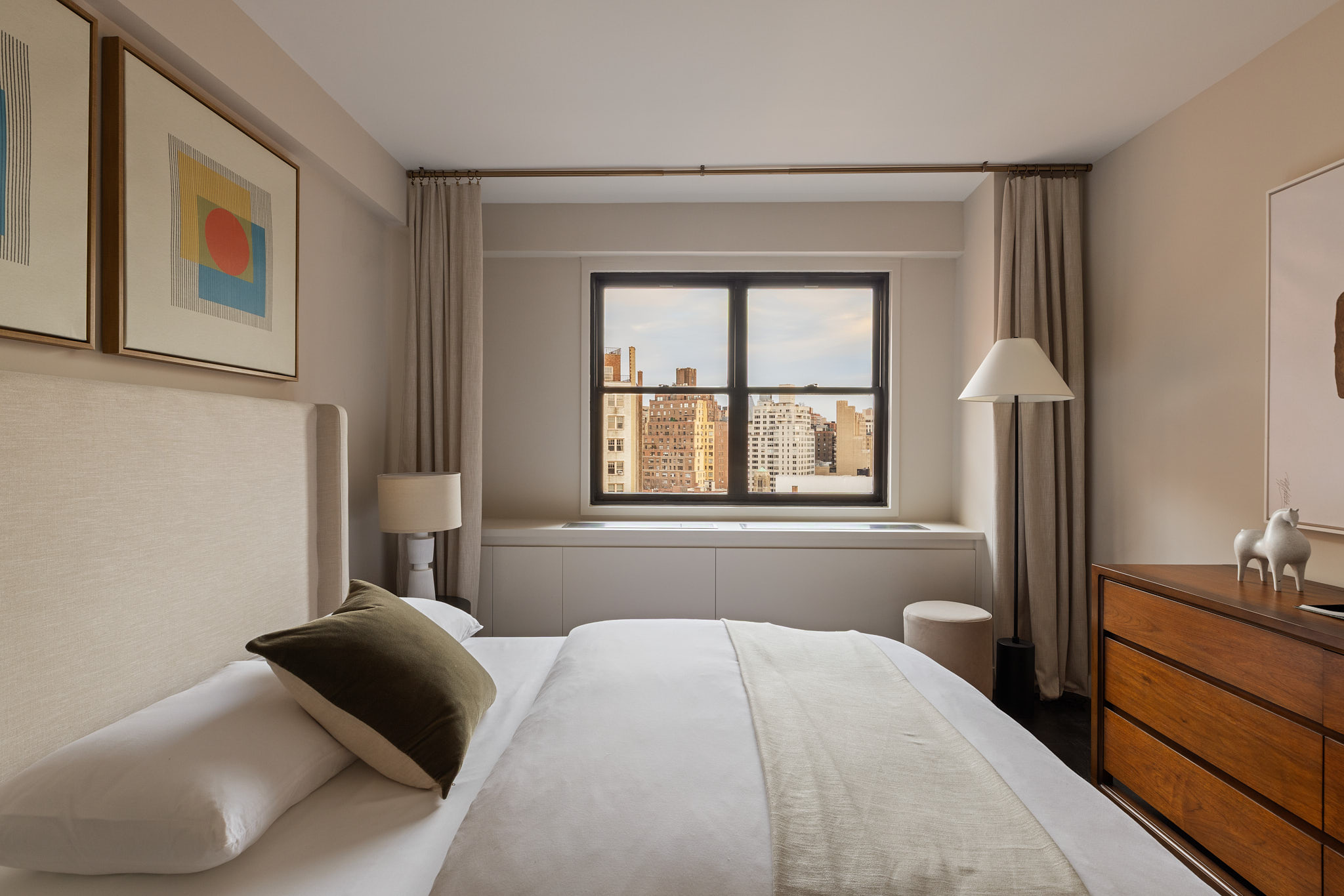 31 Jane Street, Unit 16G Manhattan, NY 10014 - Photo 14 of 20 a bedroom with a bed and a window
