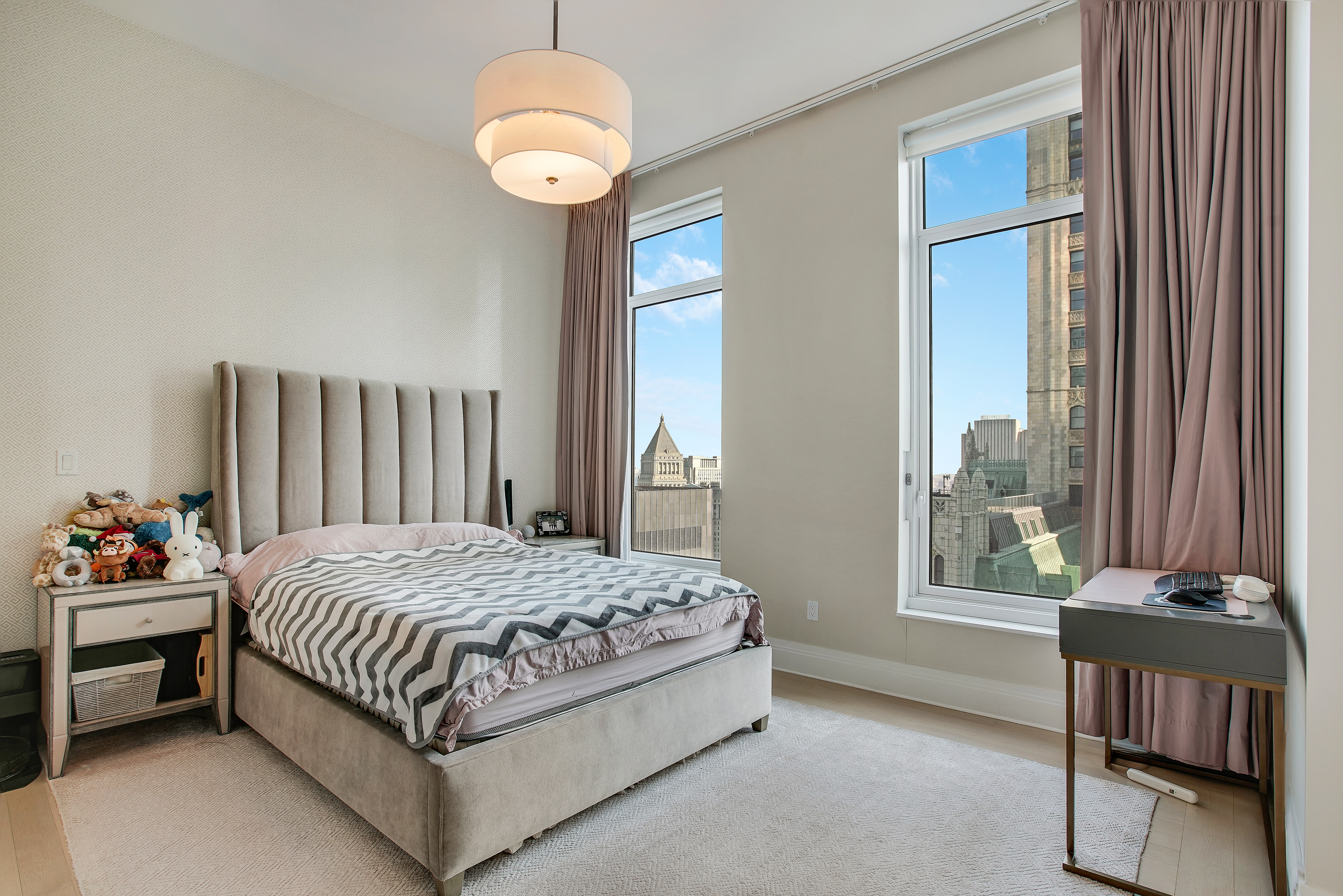 30 Park Place, Unit 46C Manhattan, NY 10007 - Photo 6 of 20 a bedroom with a bed and a window
