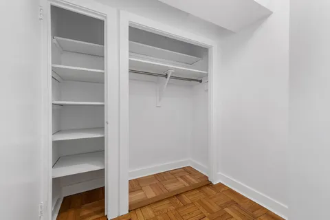 a view of an empty walk in closet