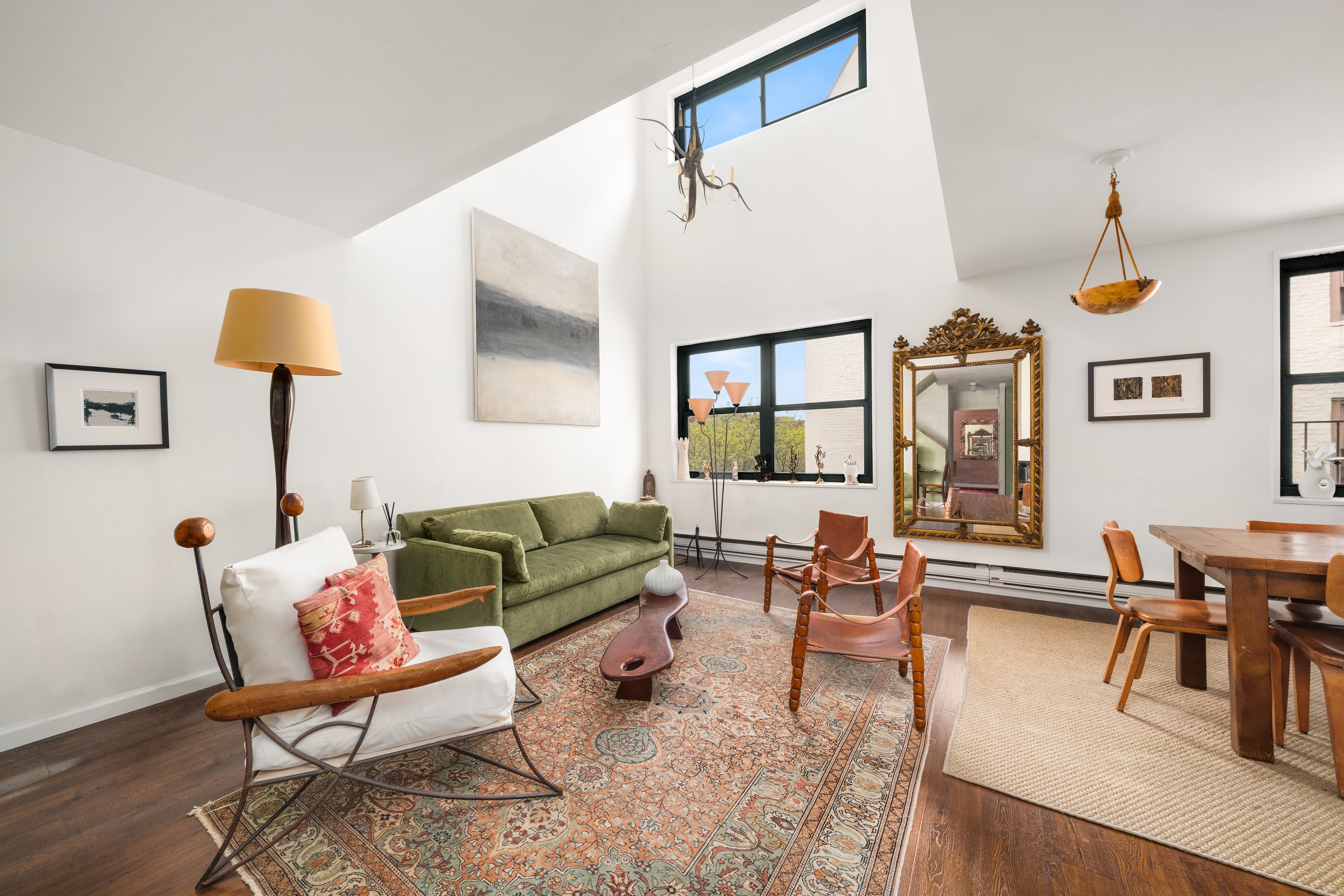 634 Washington Street, Unit 4B Manhattan, NY 10014 - Photo 1 of 12 a living room with furniture and a window