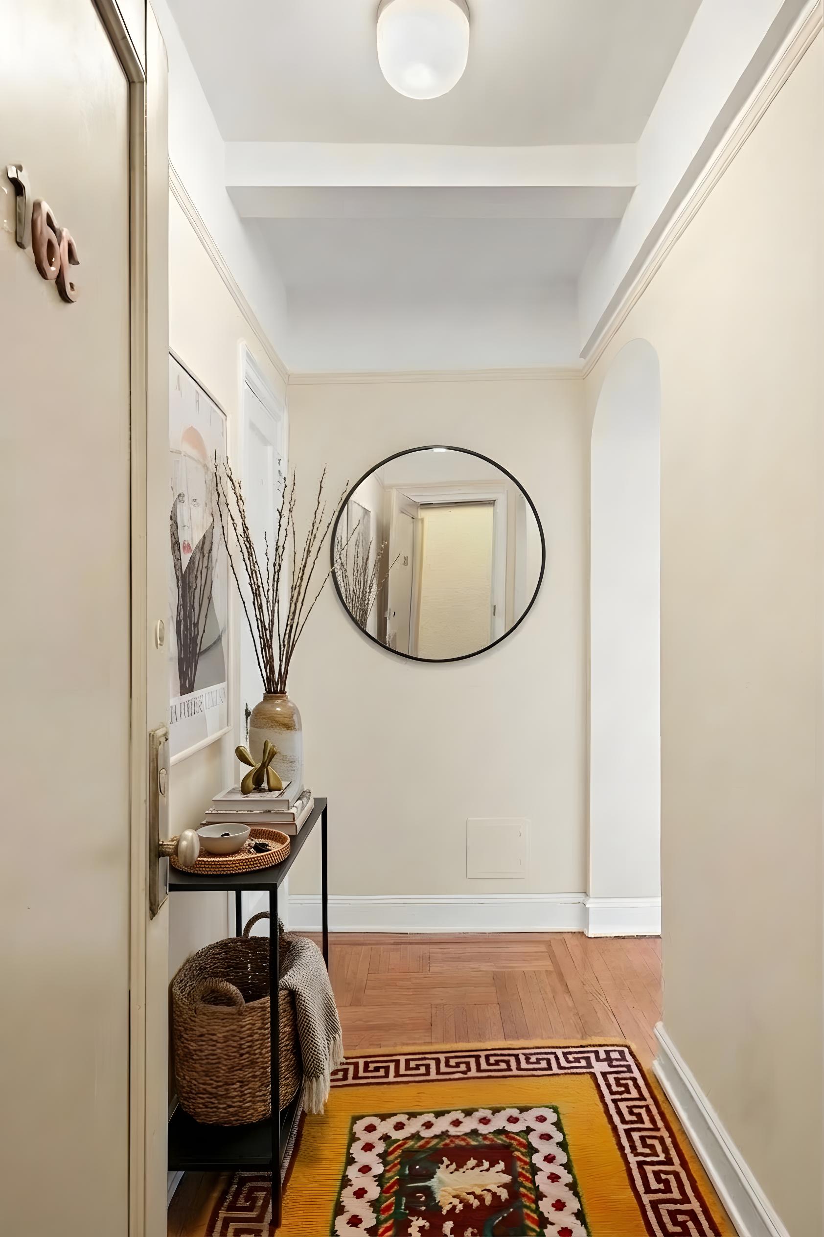 110 West 86th Street, Unit 16C Manhattan, NY 10024 - Photo 8 of 12 a view of a livingroom with furniture and a mirror
