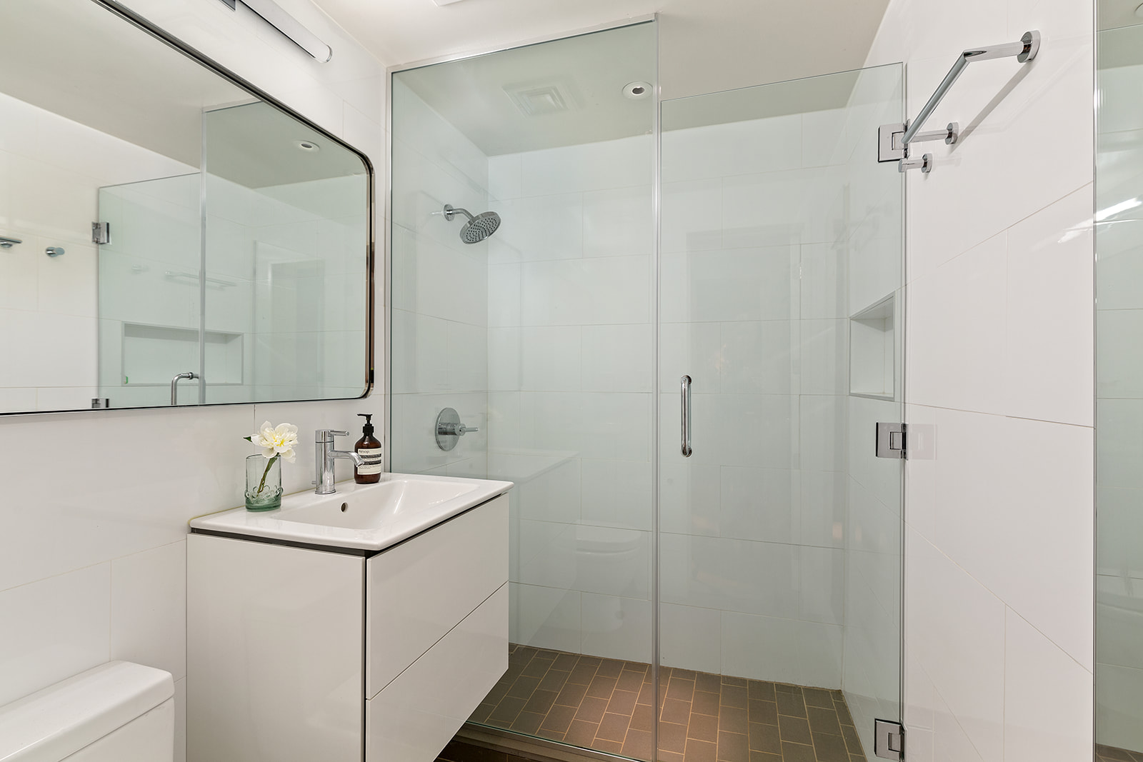 161 West 16th Street, Unit 12D Manhattan, NY 10011 - Photo 6 of 8 a bathroom with a sink and a mirror