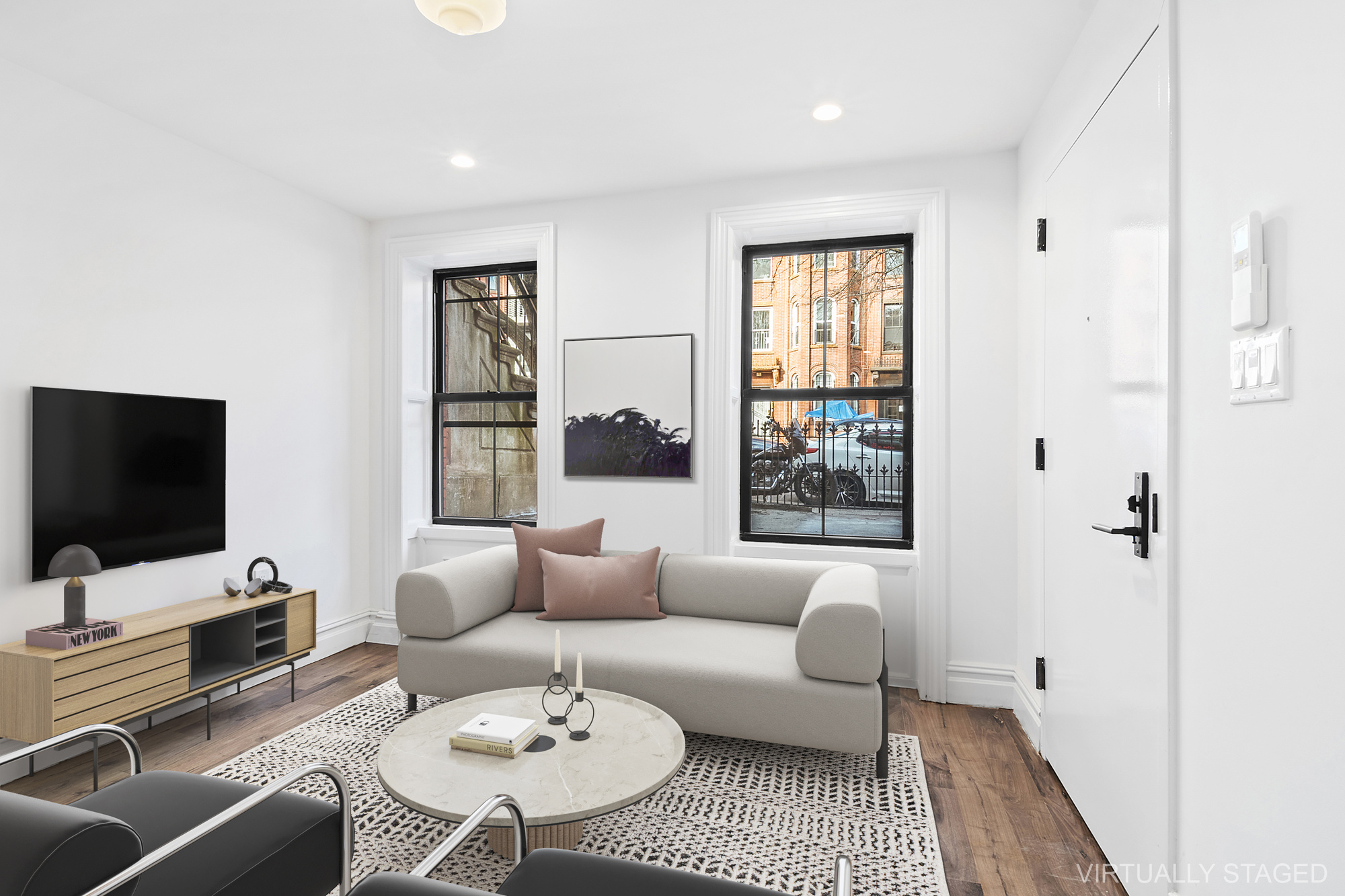 42 Eldert Street, Unit 1 Brooklyn, NY 11207 - Photo 2 of 10 a living room with furniture and a flat screen tv