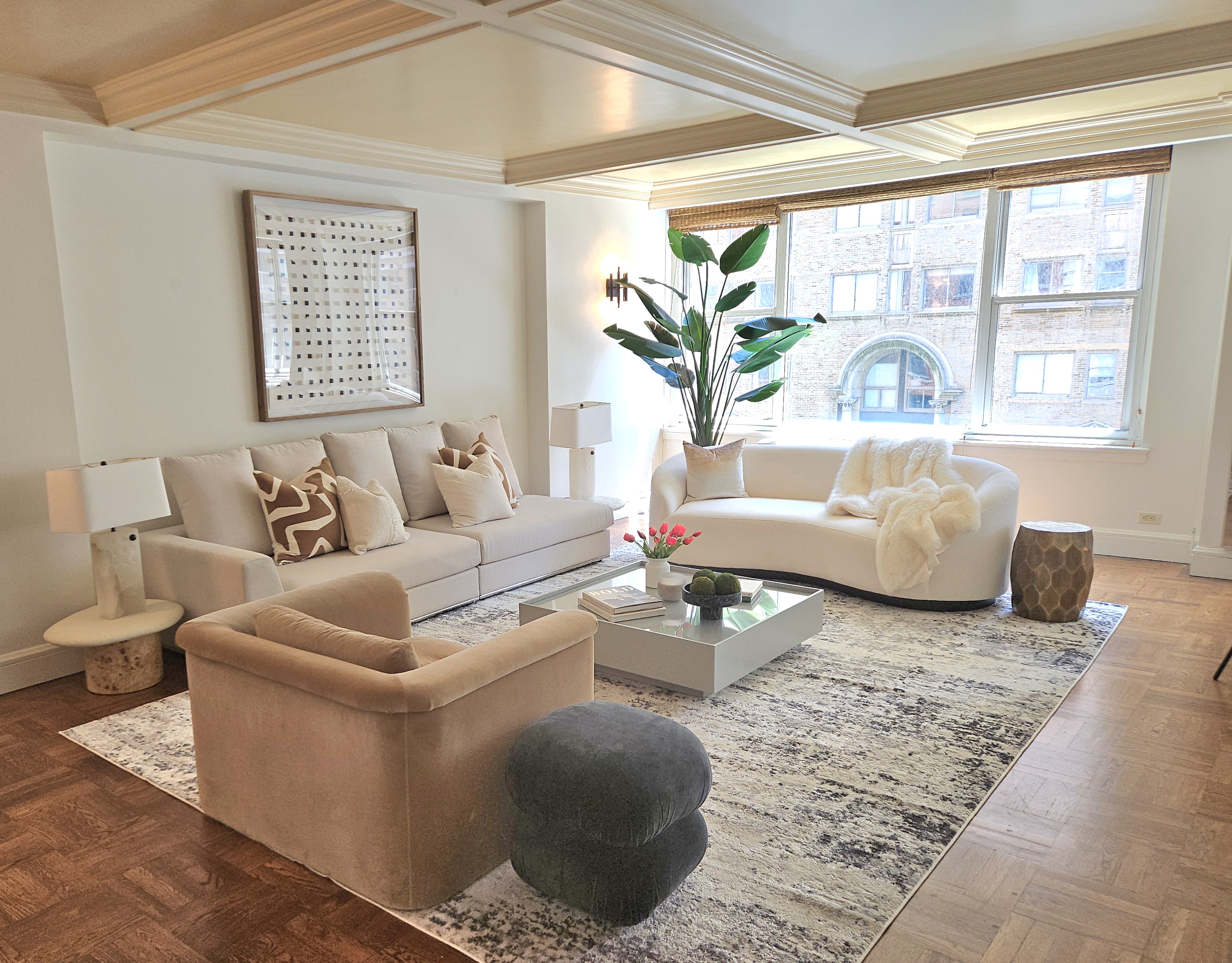 169 East 69th Street, Unit 7/8 B Manhattan, NY 10021 - Photo 5 of 30 a living room with furniture and a large window