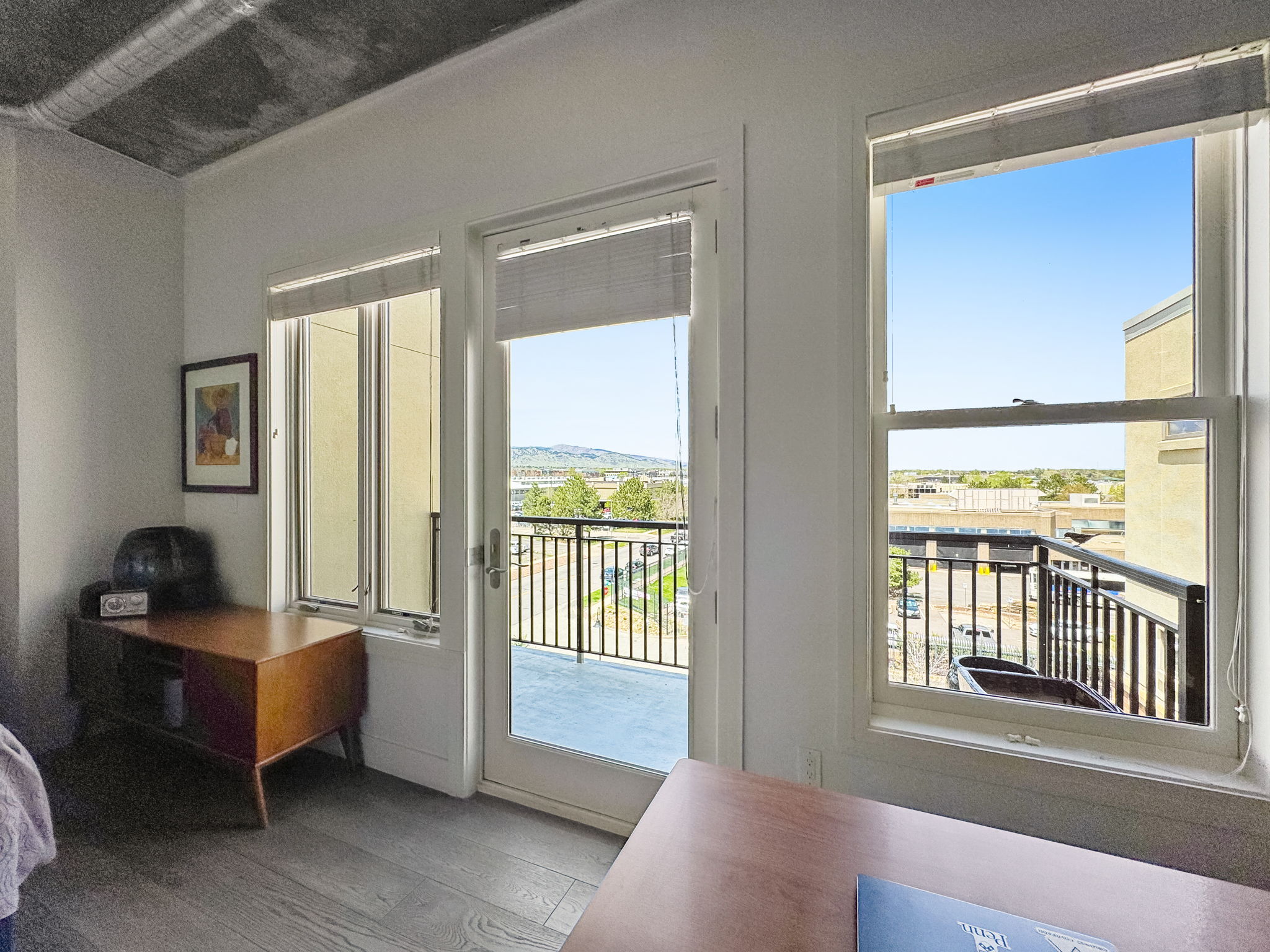3401 Arapahoe Avenue, Unit Undisclosed Boulder, CO 80303 - Photo 11 of 28 a bedroom with furniture and large windows