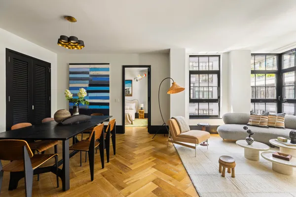 a living room with furniture and a table