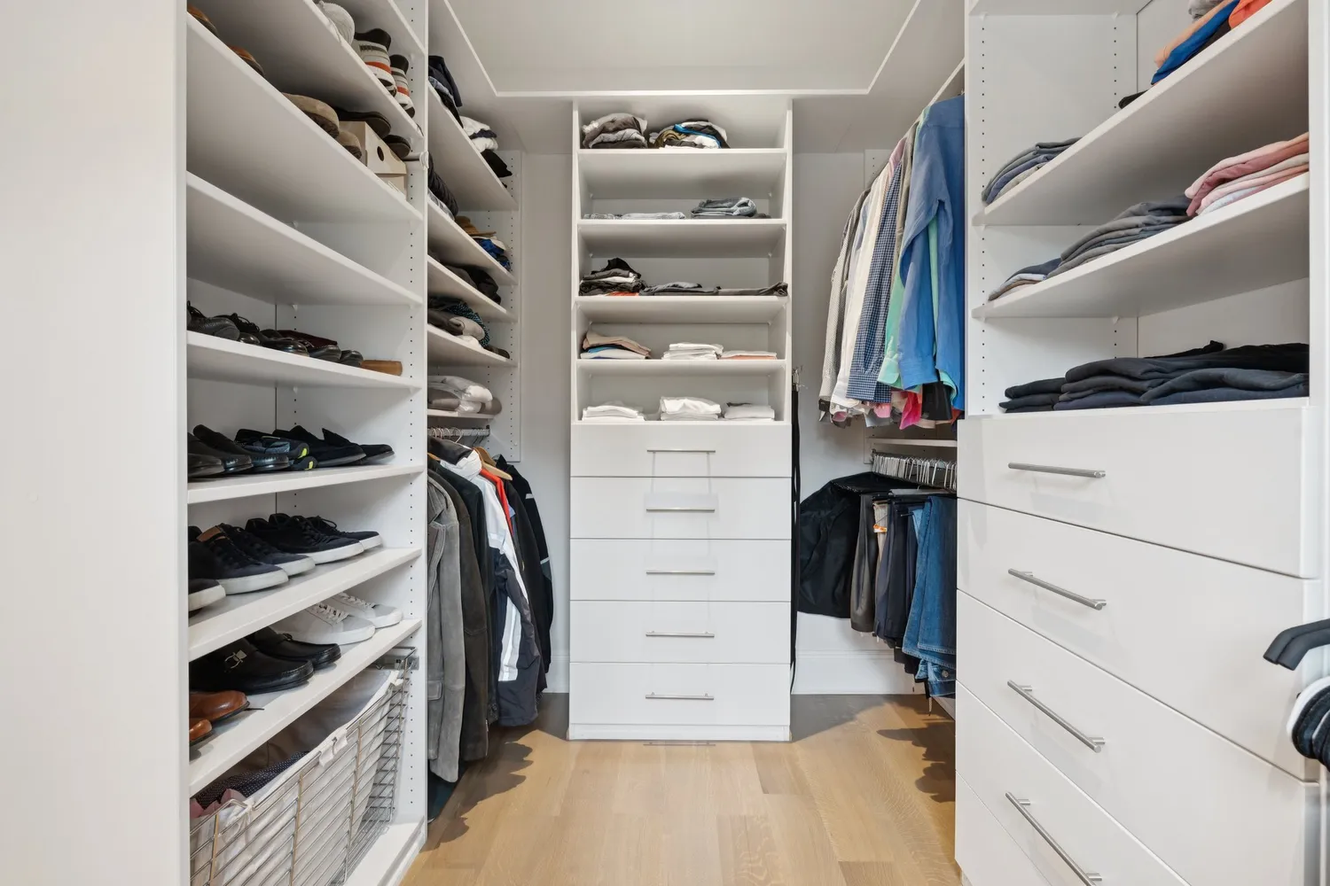 a spacious bedroom with a bed and a couch