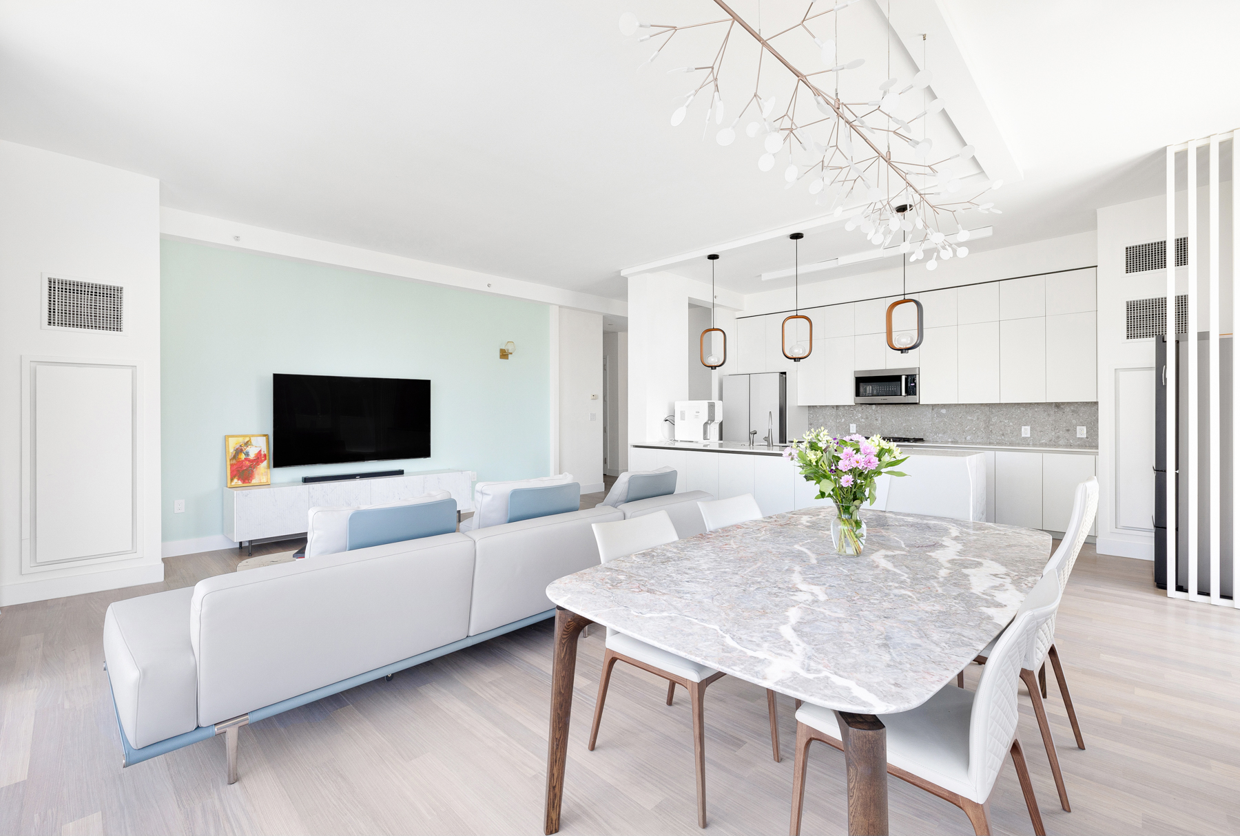 10 West End Avenue, Unit 30C Manhattan, NY 10023 - Photo 5 of 22 a living room with furniture and a flat screen tv