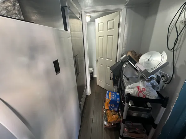 a bathroom with a sink and mirror with toilet