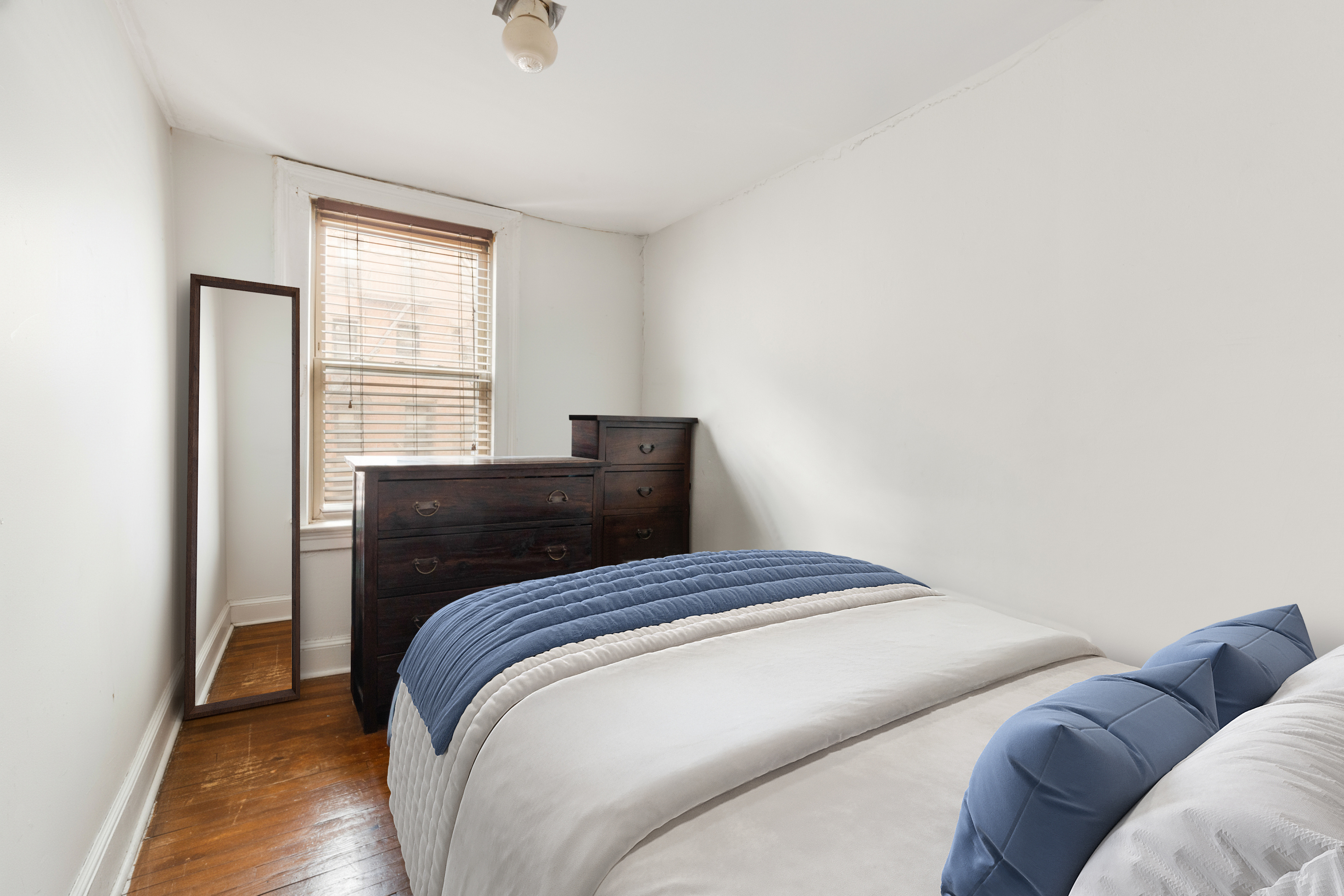 446 State Street Brooklyn, NY 11217 - Photo 12 of 23 a bedroom with a bed and a window
