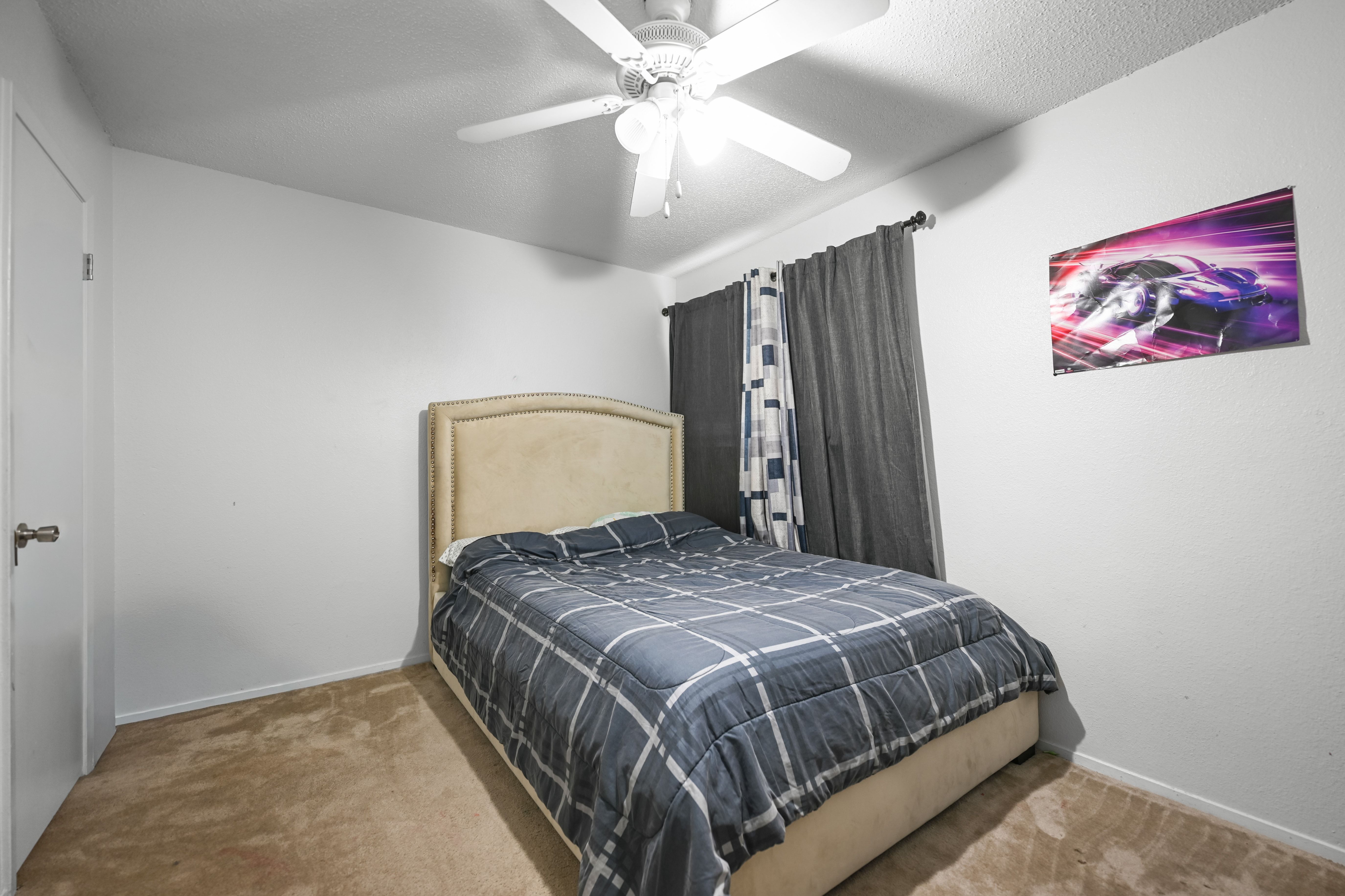 8710 Clearbrook Trail Austin, TX 78729 - Photo 24 of 28 a bedroom with a bed and a painting on the wall