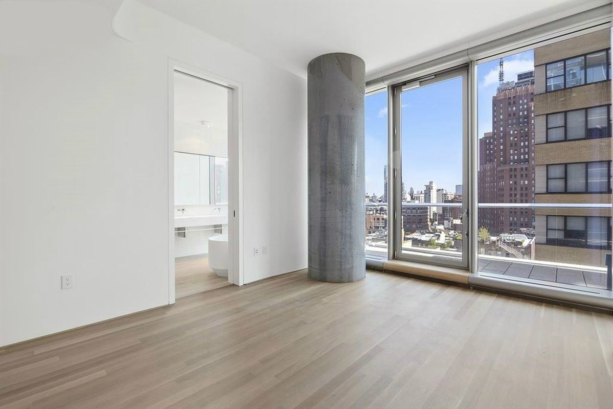 56 Leonard Street, Unit 12AEAST Manhattan, NY 10013 - Photo 2 of 11 a view of a room with wooden floor and a window