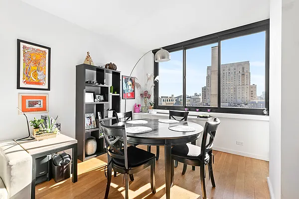 515 East 72nd Street, Unit 22E Manhattan, NY 10021 - Photo 5 of 18 a view of a dining room with furniture window and outside view