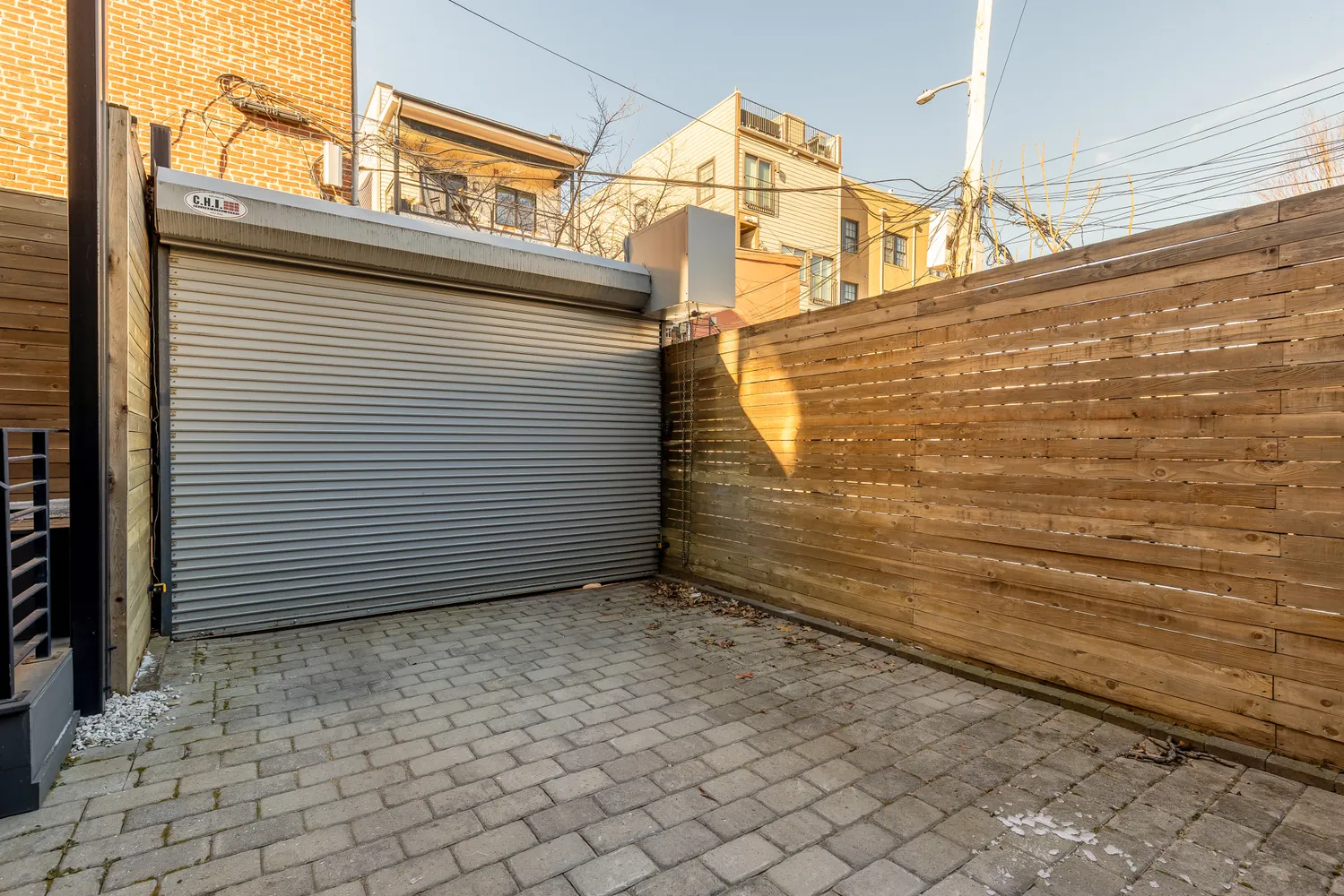 a view of a patio with chairs and a potted plant