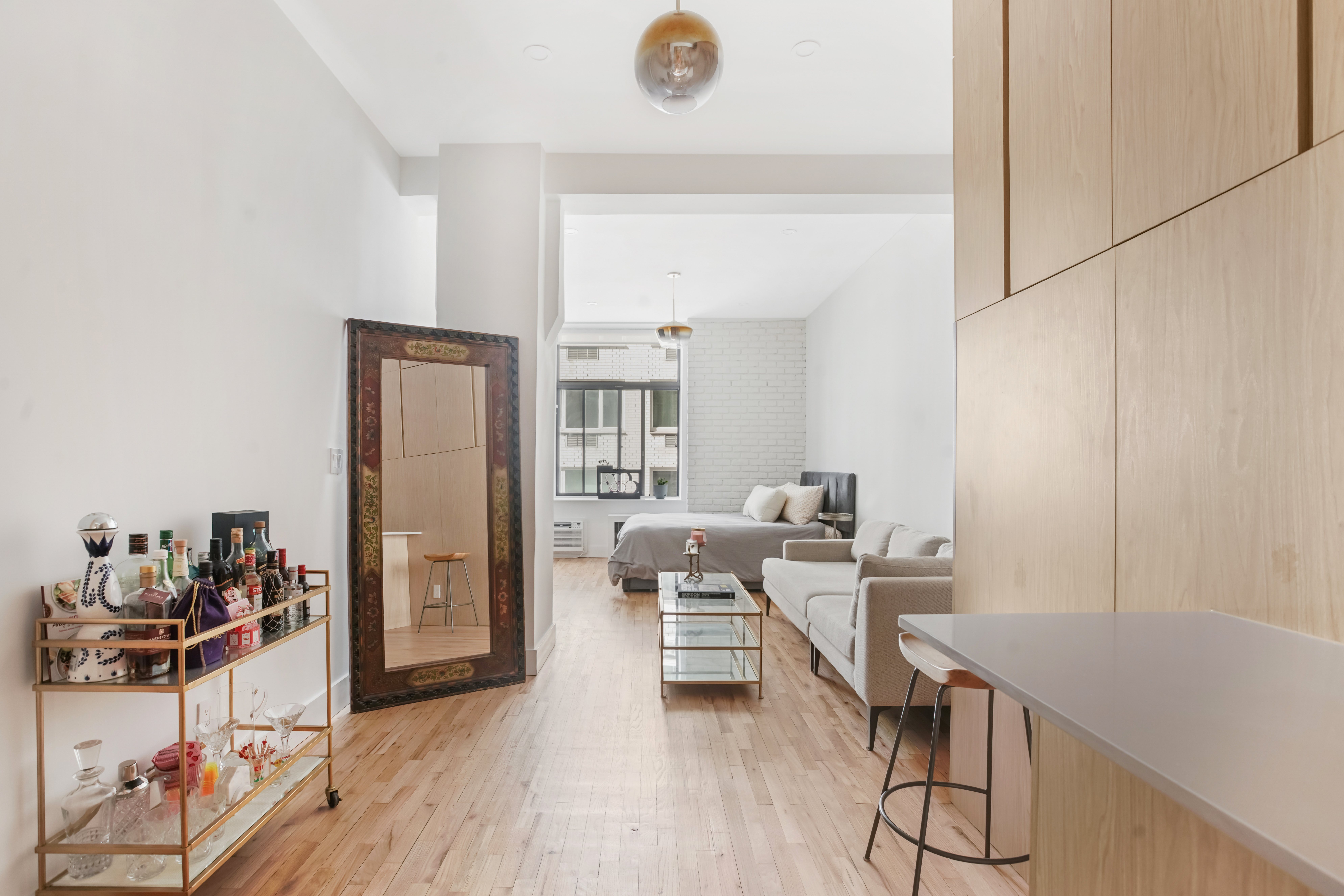 310 East 23rd Street, Unit 3B Manhattan, NY 10010 - Photo 1 of 11 a workspace with wooden floor