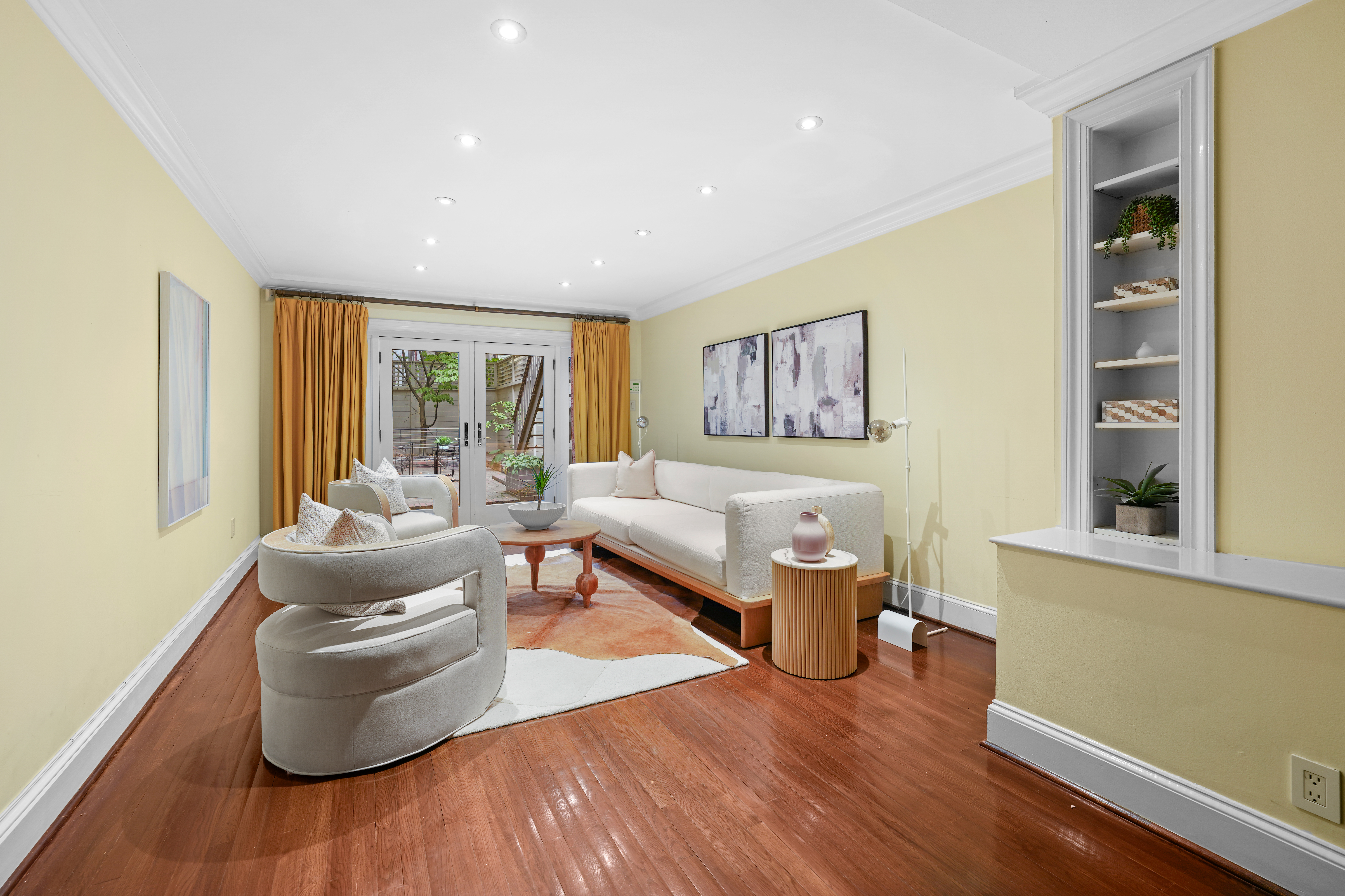 247 East 71st Street Manhattan, NY 10021 - Photo 3 of 31 a living room with furniture and a large window