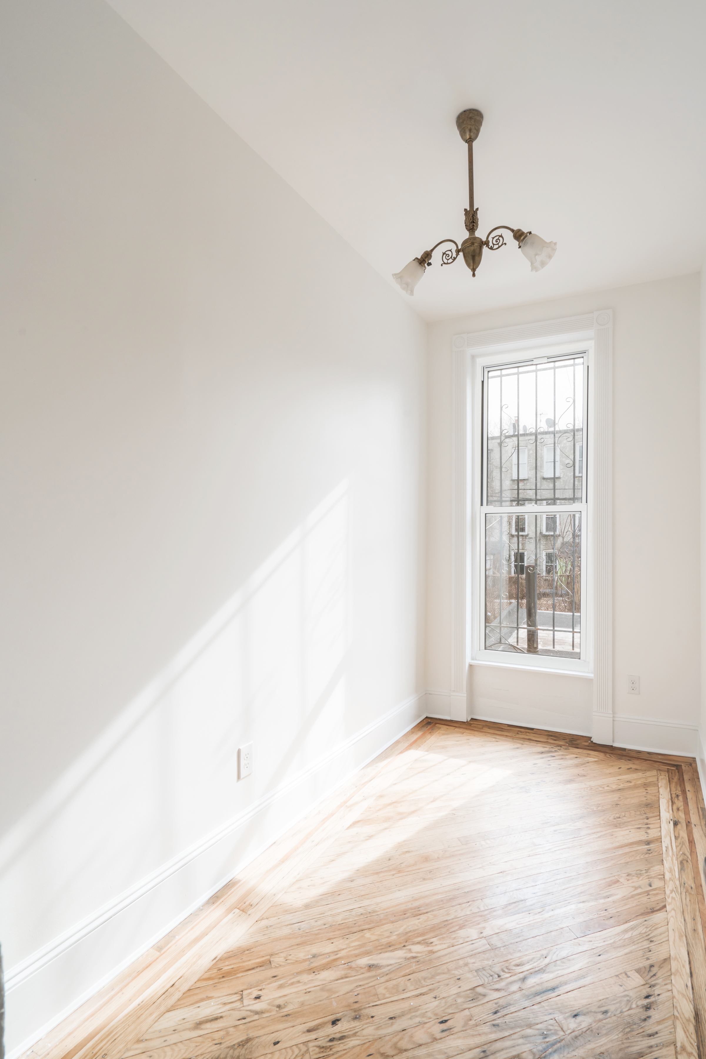 670 Macon Street, Unit 2 Brooklyn, NY 11233 - Photo 4 of 16 a view of an empty room with a window