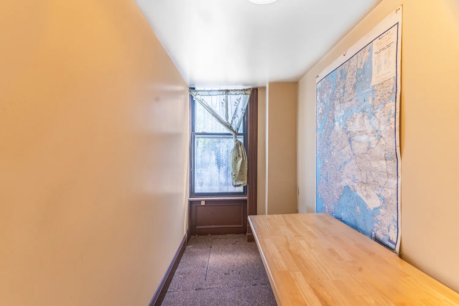 a view of kitchen and hall with wooden floor