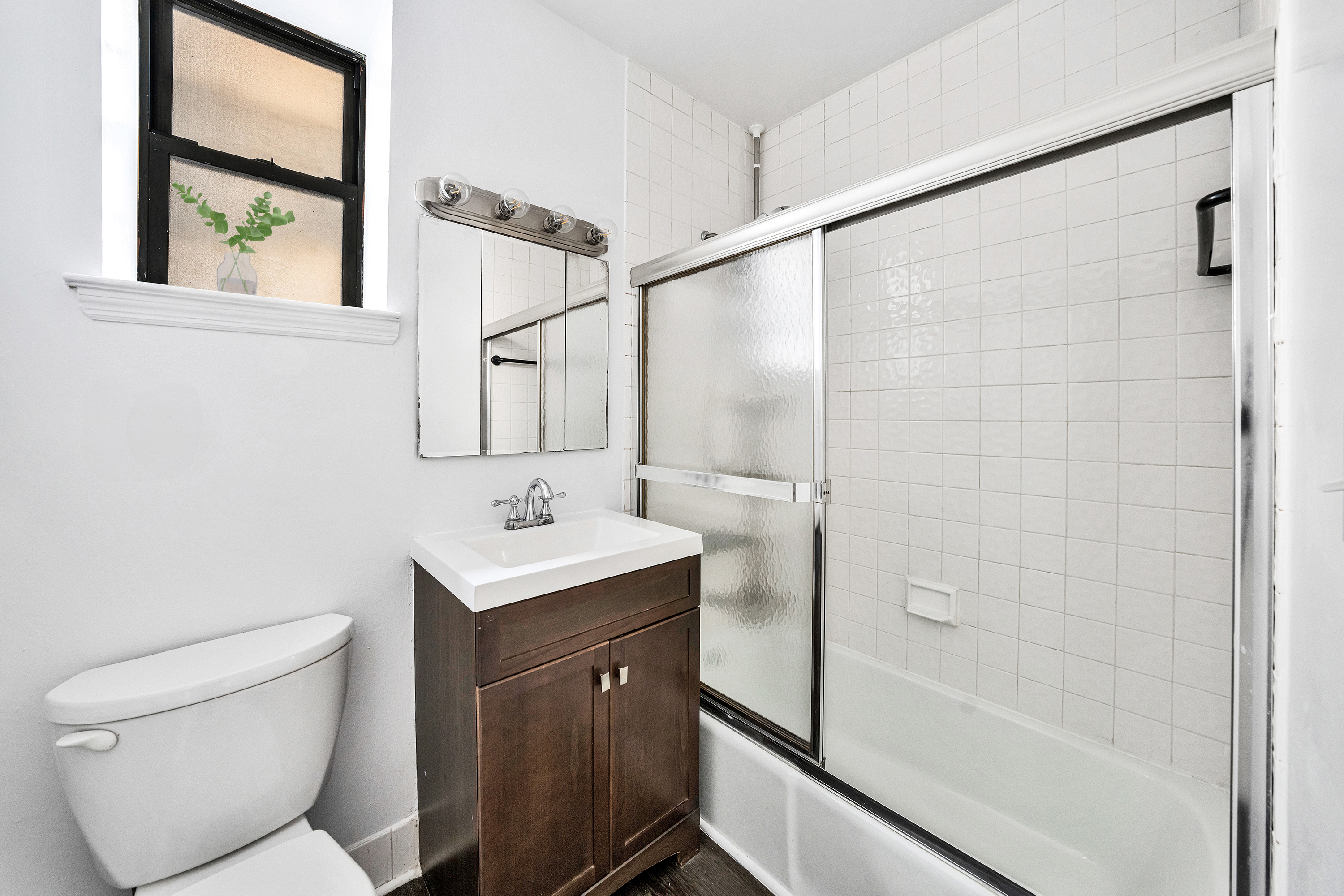430 Sterling Place, Unit 2B Brooklyn, NY 11238 - Photo 7 of 14 a bathroom with a sink toilet and shower