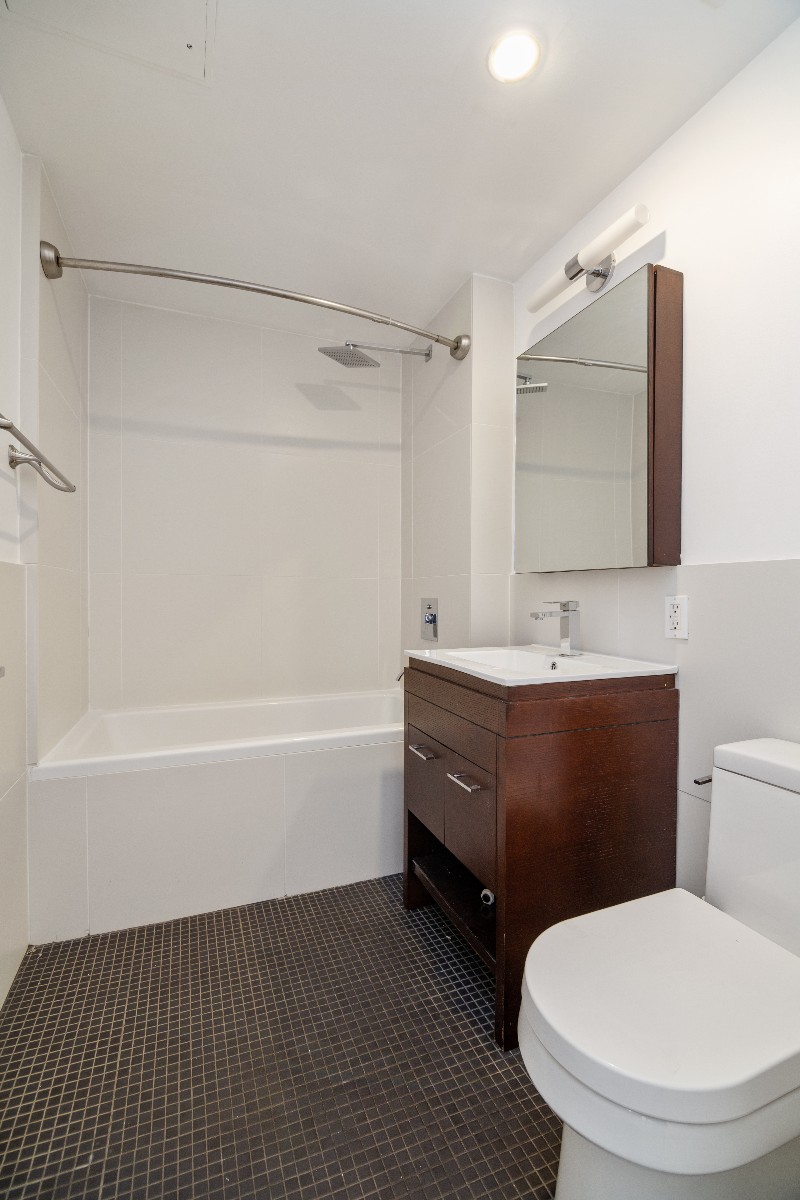 659 Bergen Street, Unit 3D Brooklyn, NY 11238 - Photo 6 of 7 a bathroom with a sink a toilet and bathtub