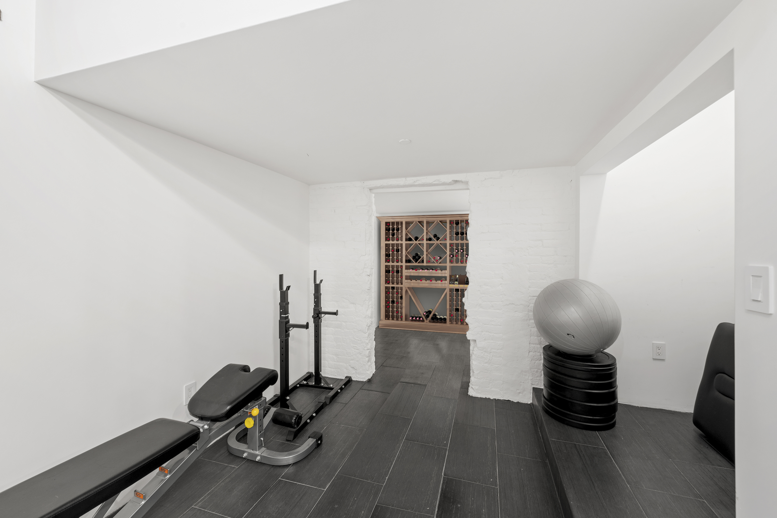 60 Collister Street, Unit 1B Manhattan, NY 10013 - Photo 14 of 20 a view of a workspace with furniture and gym equipment