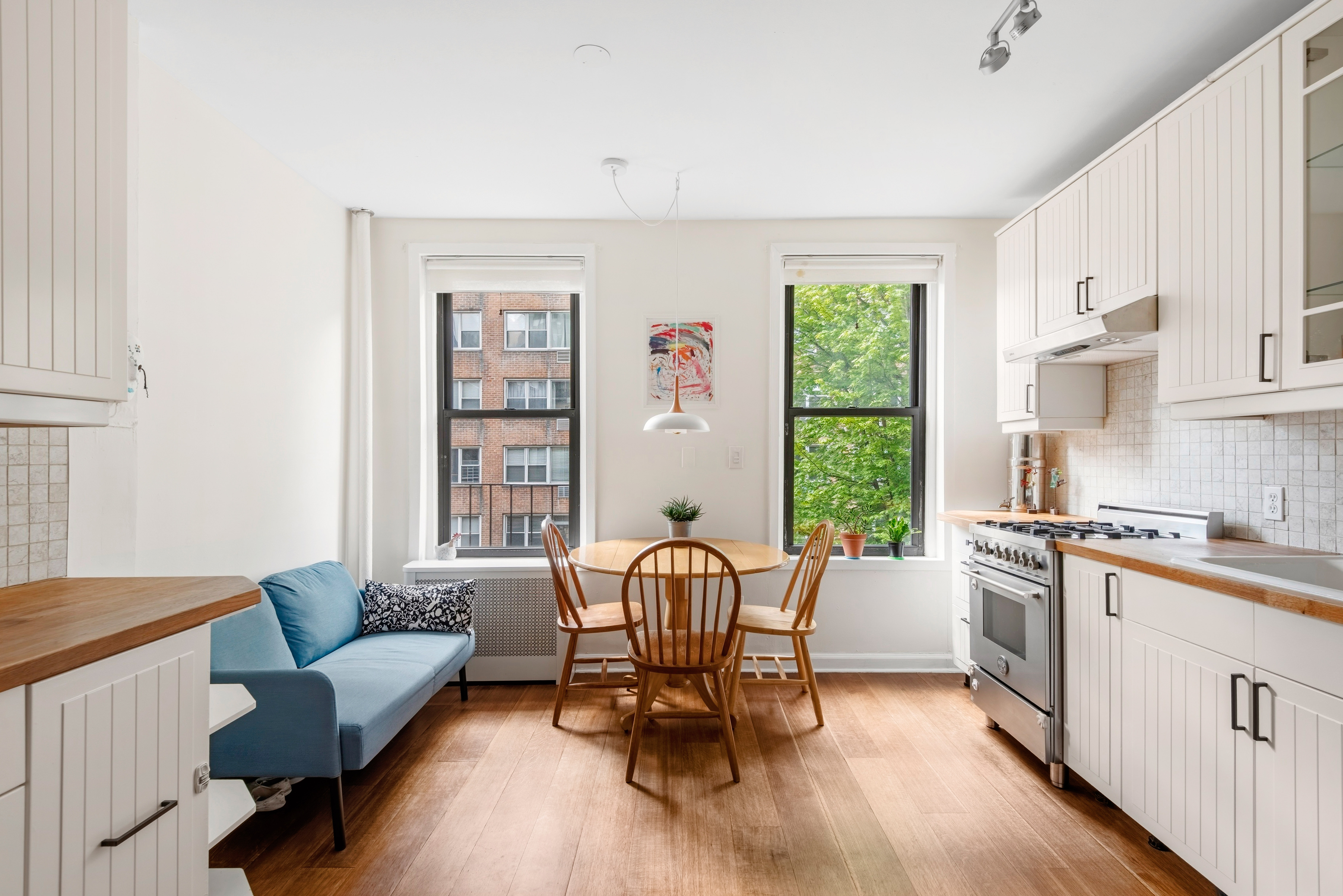 436 East 66th Street, Unit 4E Manhattan, NY 10065 - Photo 2 of 19 a living room with furniture and a large window