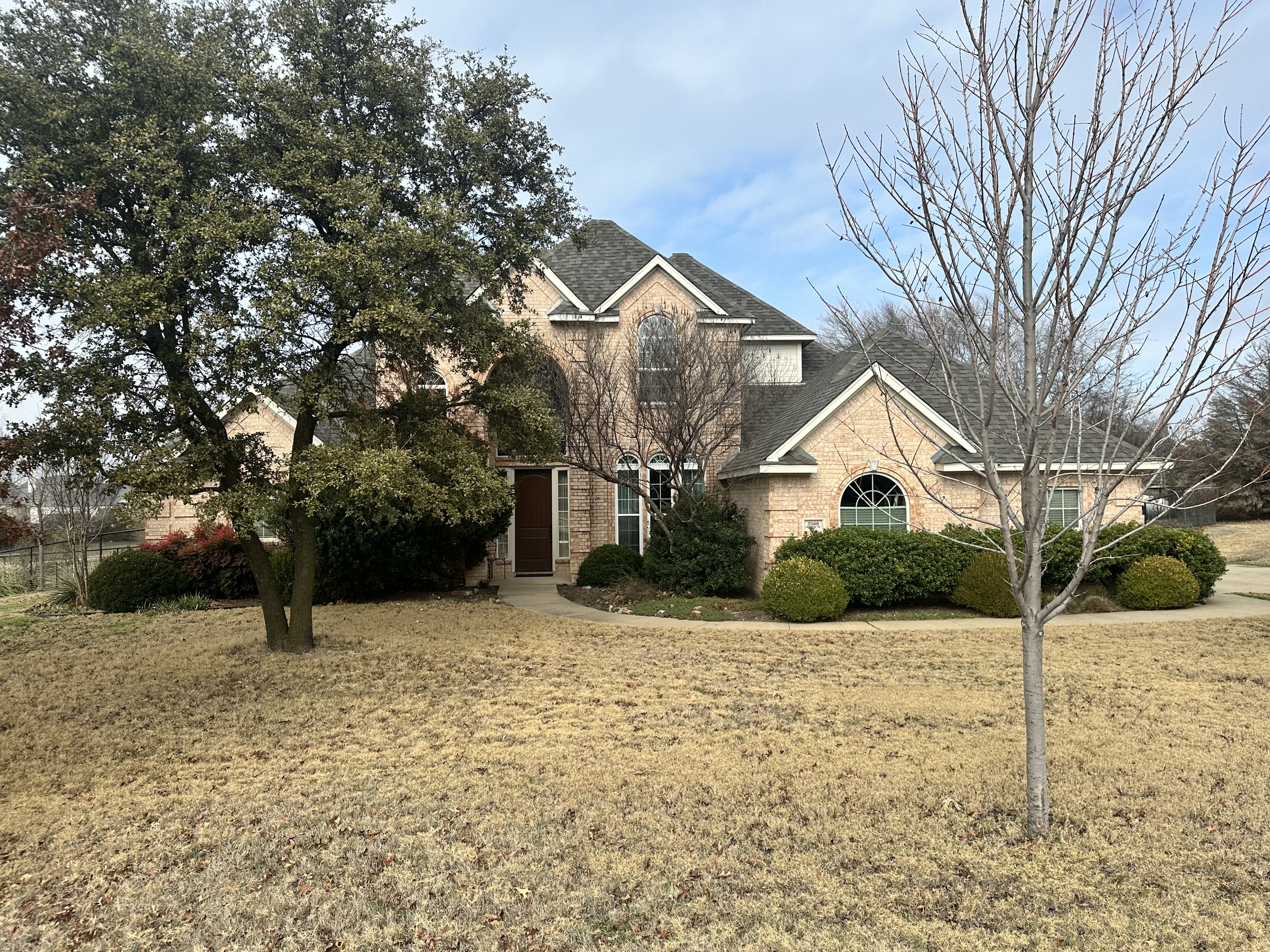 3588 Heritage Trail Celina, TX 75009 - Photo 1 of 19 a view of a house with a yard covered in snow